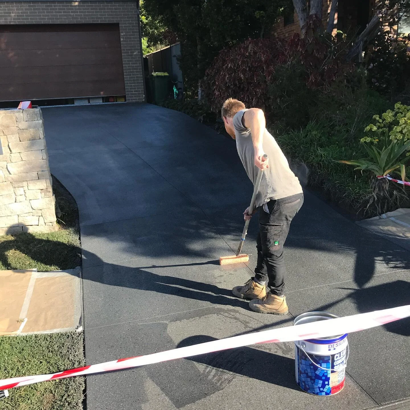 Sealing the deal. 

Once coloured spraycrete has been applied to your concrete driveway and has dried completely, a clear sealer is rolled/sprayed over the top to protect the colour. 

This layer of sealer should be reapplied roughly every two years 