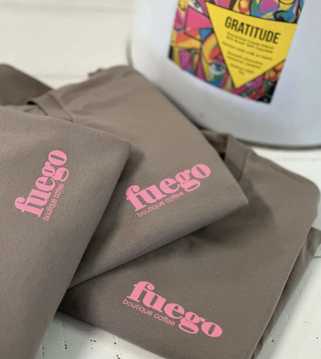 Fuego Coffee shirts with a bag of Gratitude coffee