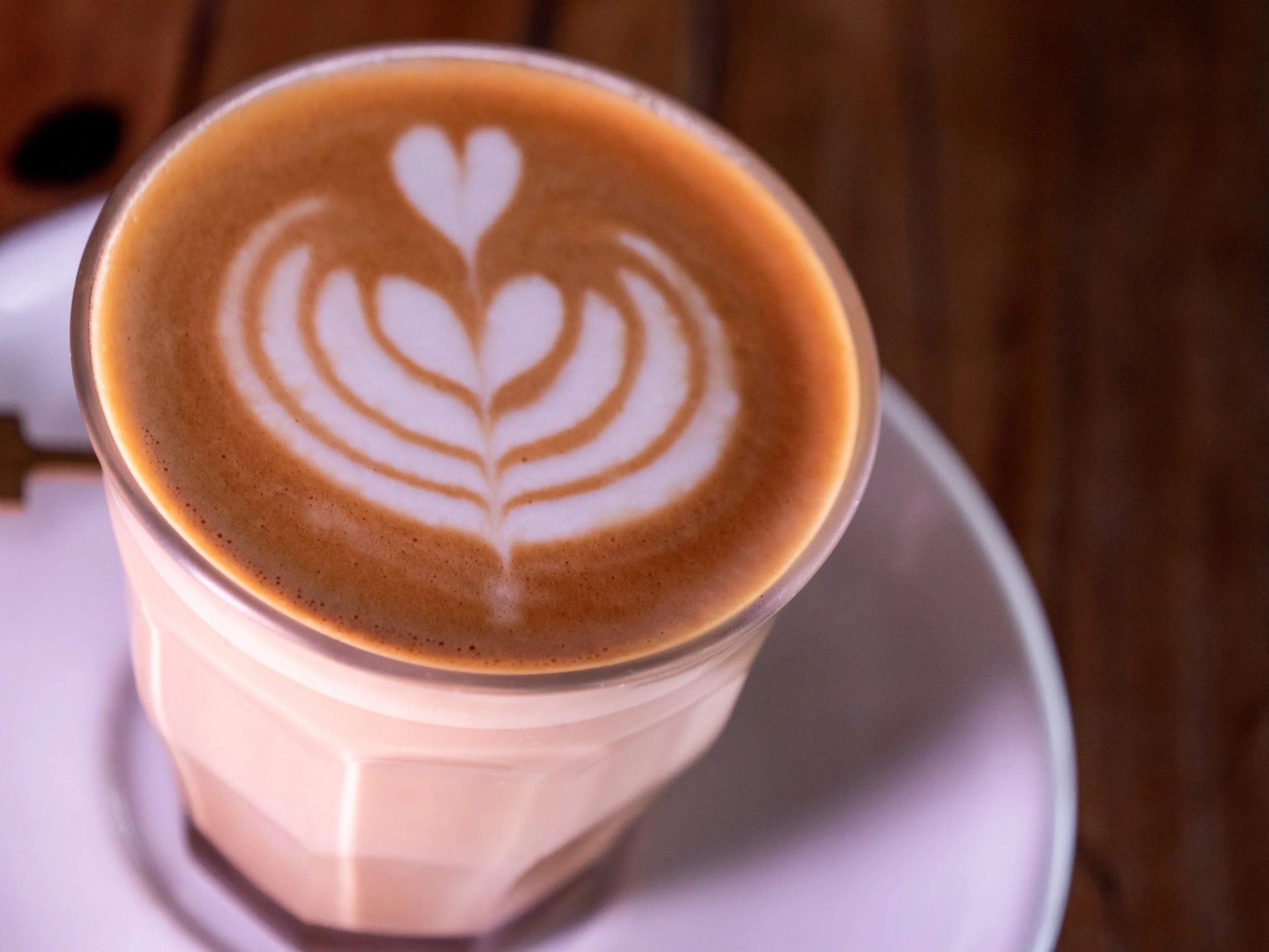 Cup of Gratitude coffee with latte art.