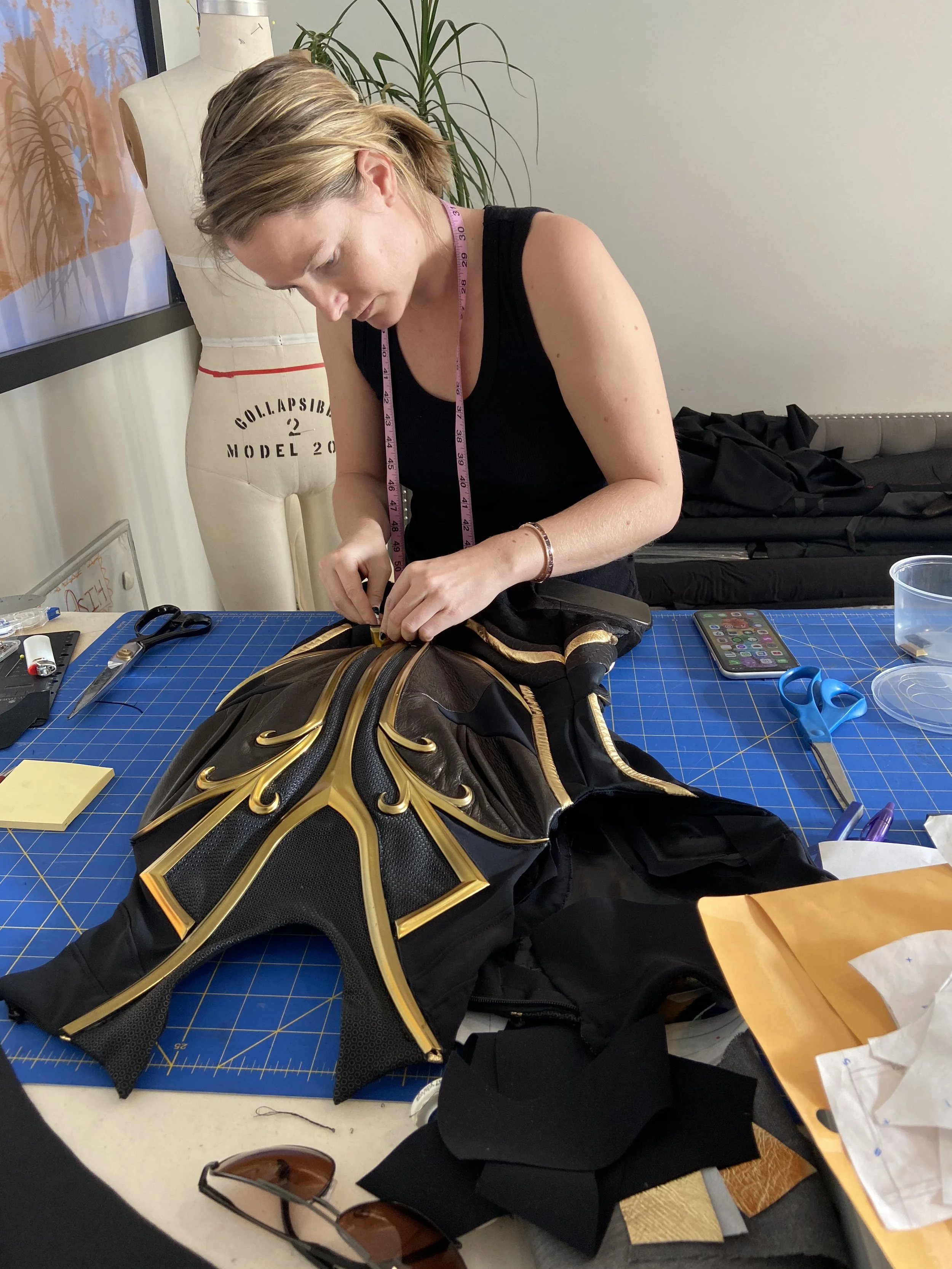 Joanna Hadfield does the painstaking detail work on the chests.
