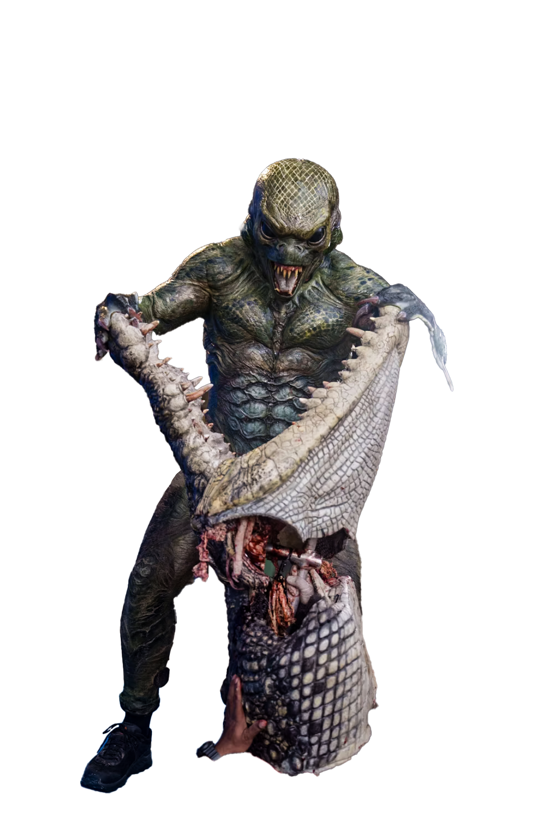 He rips the jaw off of a huge crocodile.