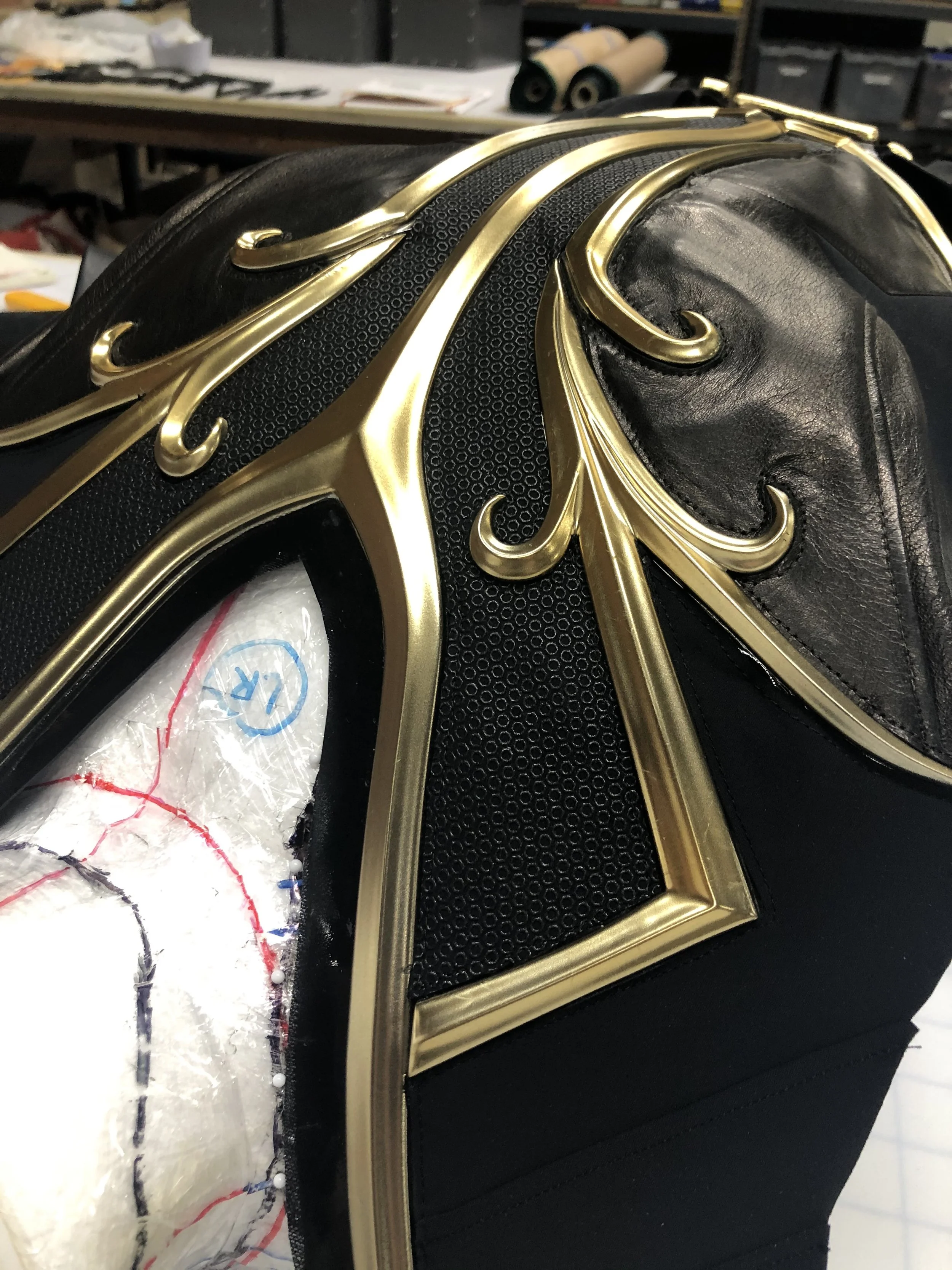 First chest piece stitched together, with screen-printed texture panels and leather. 