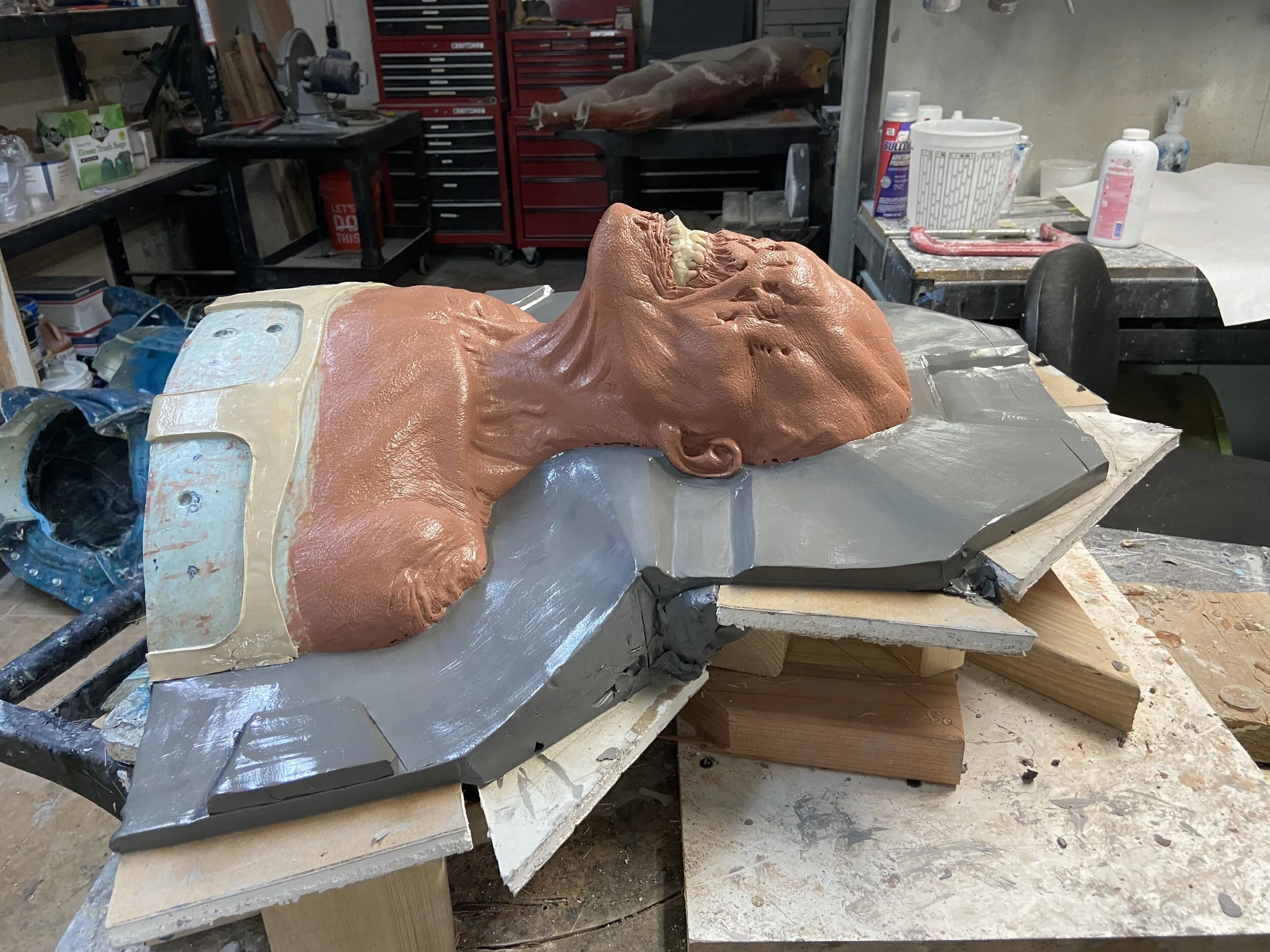 Molding the head sculpture. The clay wall that will form side 1. Side 1 then forms side 2.