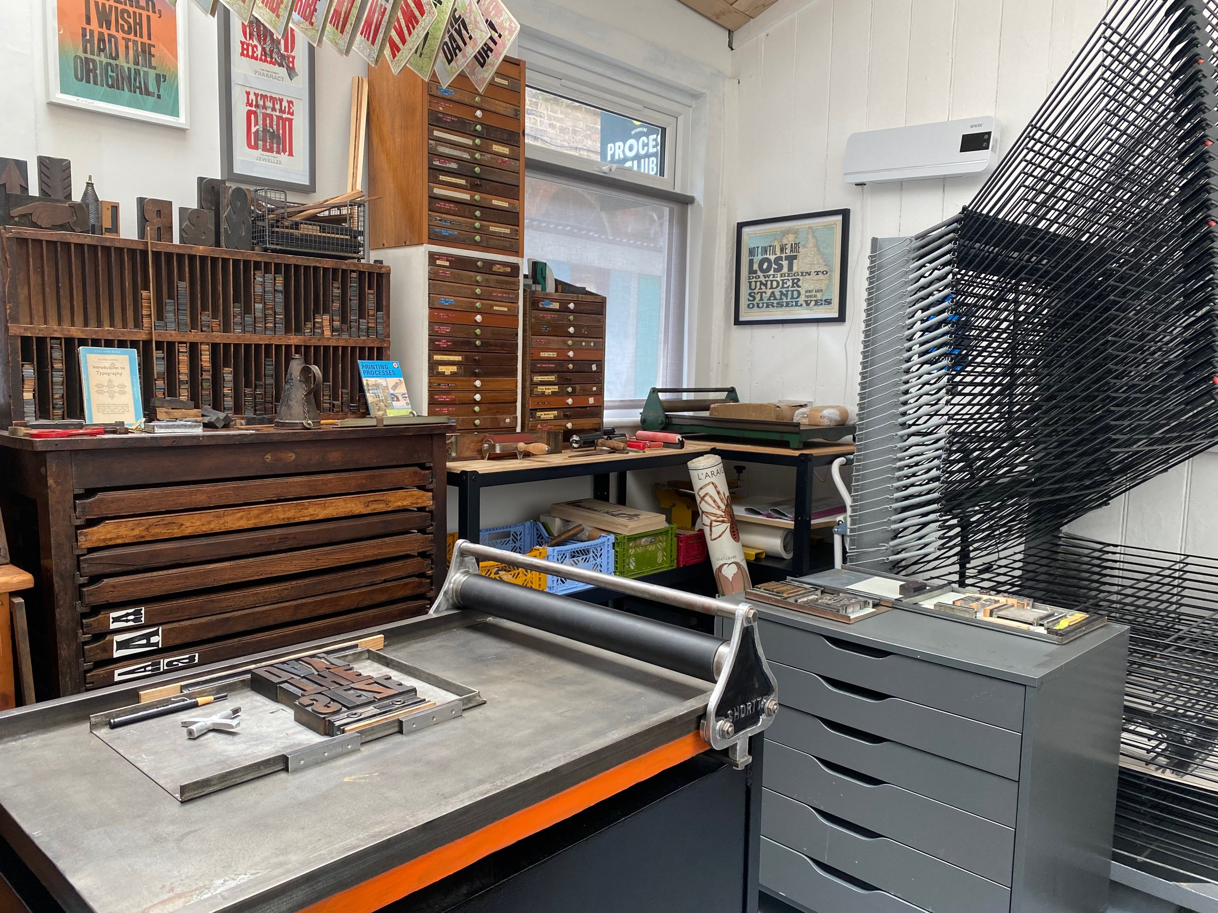 Proofing presses and wood type, metal type cabinets