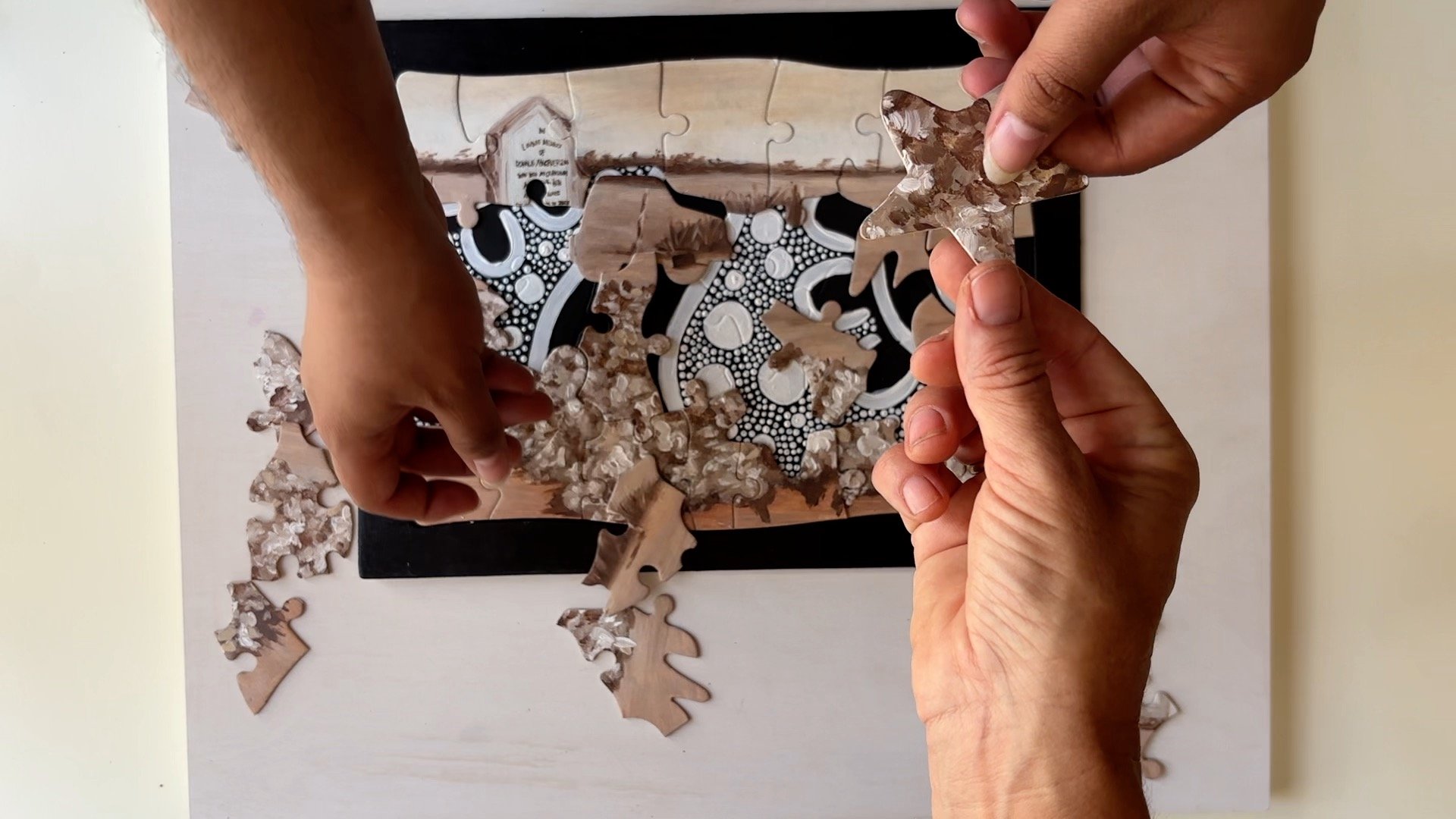 With Tymia Councillor. 1931 (Flowers on a grave), Digital video 4min57sec & recycled jigsaw puzzle. Base: Acrylic on cardboard top: acrylic & oil on cardboard, 25x30cm, 2024 

                                                                          