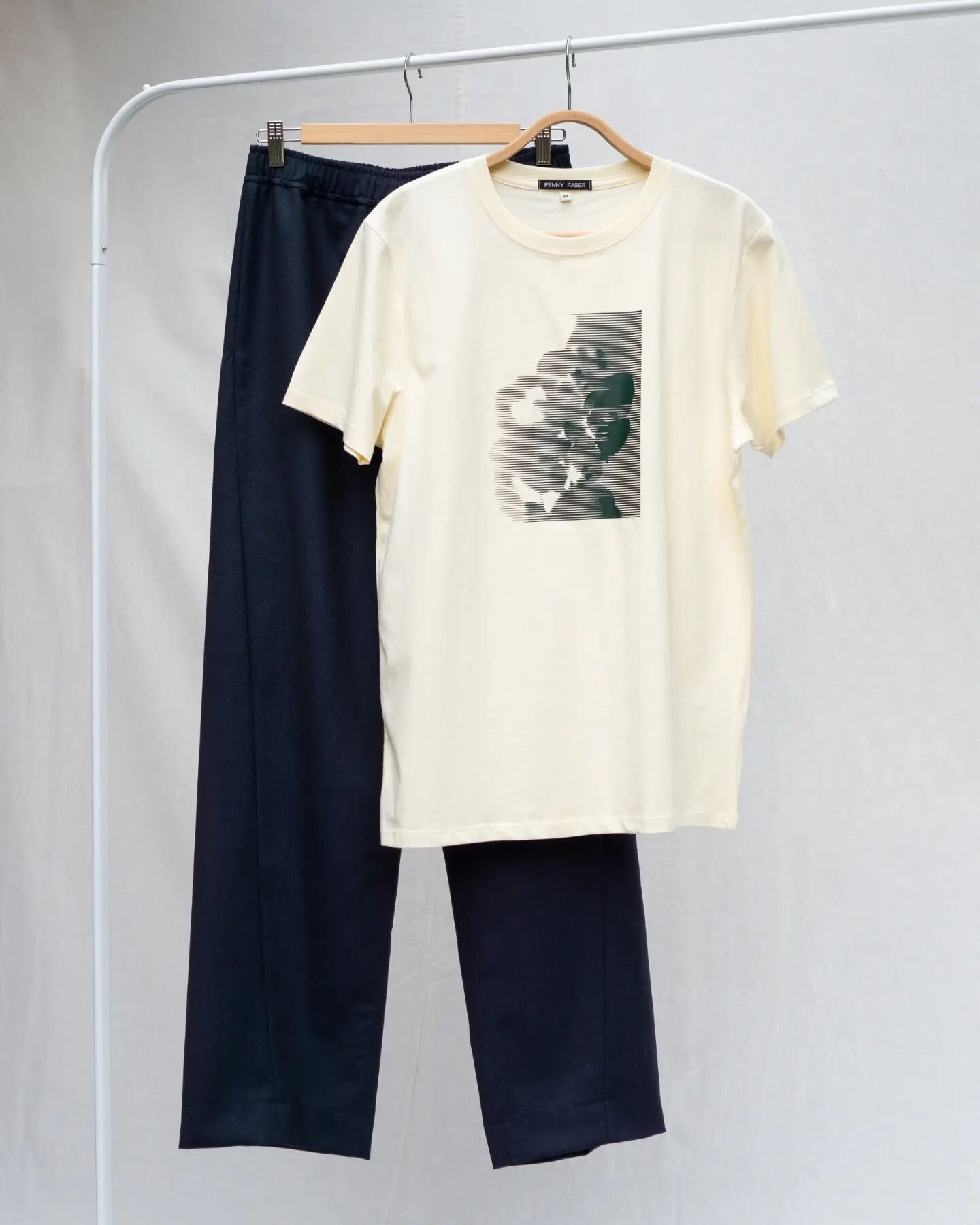 Get ready to embrace a cool and athletic style with this combo! The printed unisex t-shirt perfectly complements the woolen pants with twisted seams, inspired by the fit of oldskool track pants. ⁠
⁠
⁠
⁠
#slowfashionbrand #minimalfashion #fennyfaber #