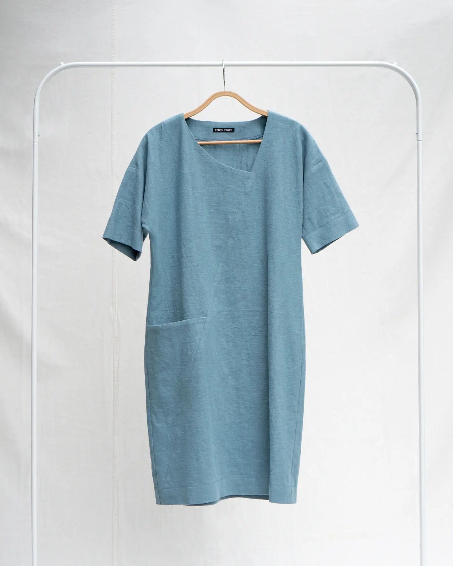 The asymmetrical dress with pocket is back in a blue hue, made from a washed linen. ⁠
#madeonorder --&gt; Made for you! Check out our webshop⁠
⁠
⁠
⁠
#duurzamekleding #linendress #madelocally #sustainablestyle