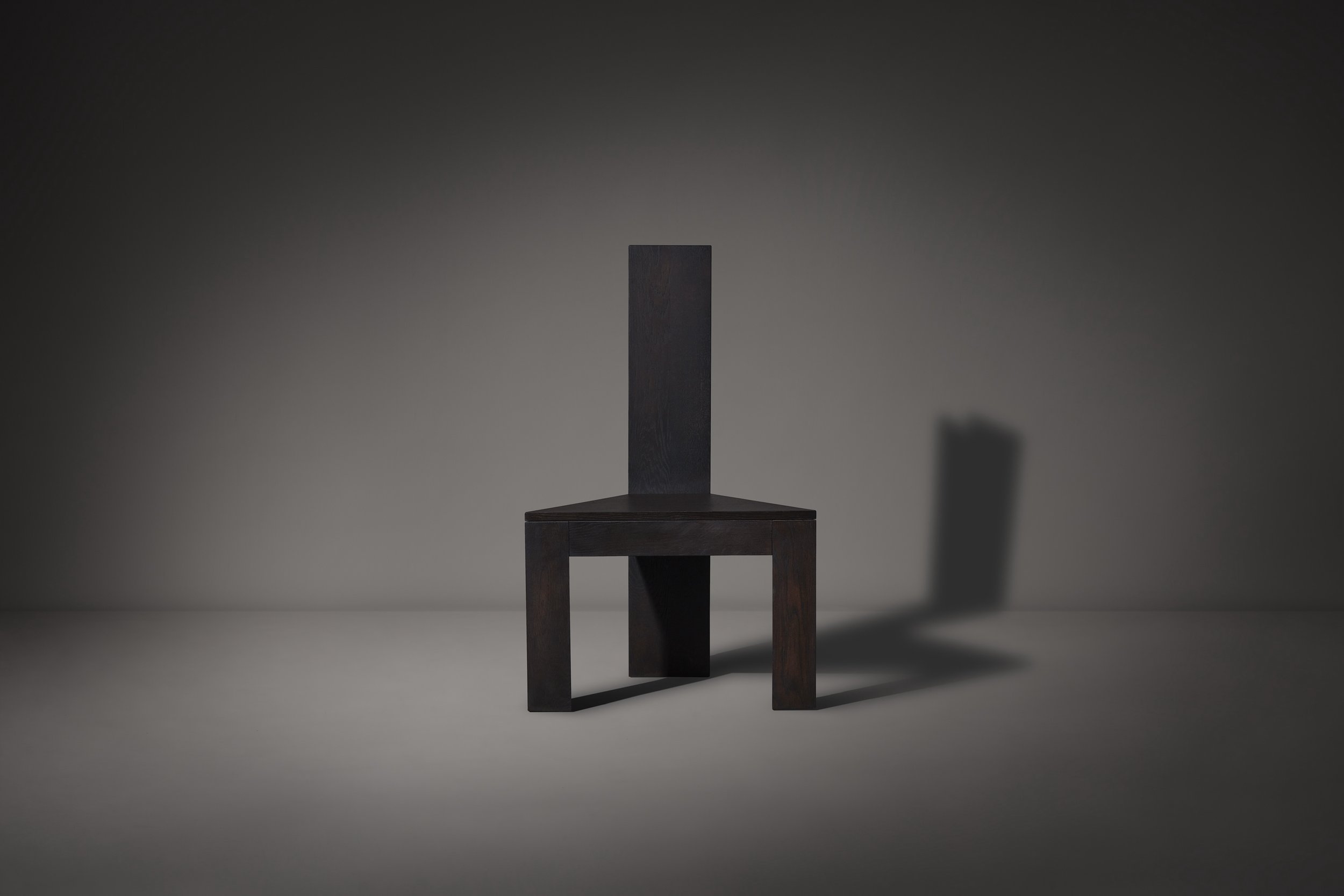 Trigon Chair - dark brown red hue oak - front view.jpg