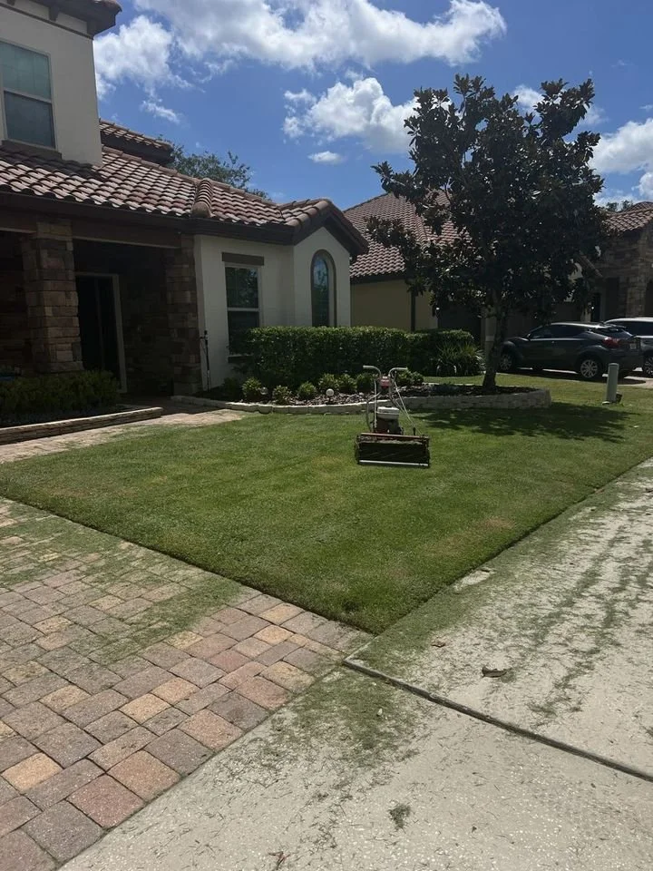 Reel-mowed Zoysia lawn with paver driveway in Winter Springs Florida