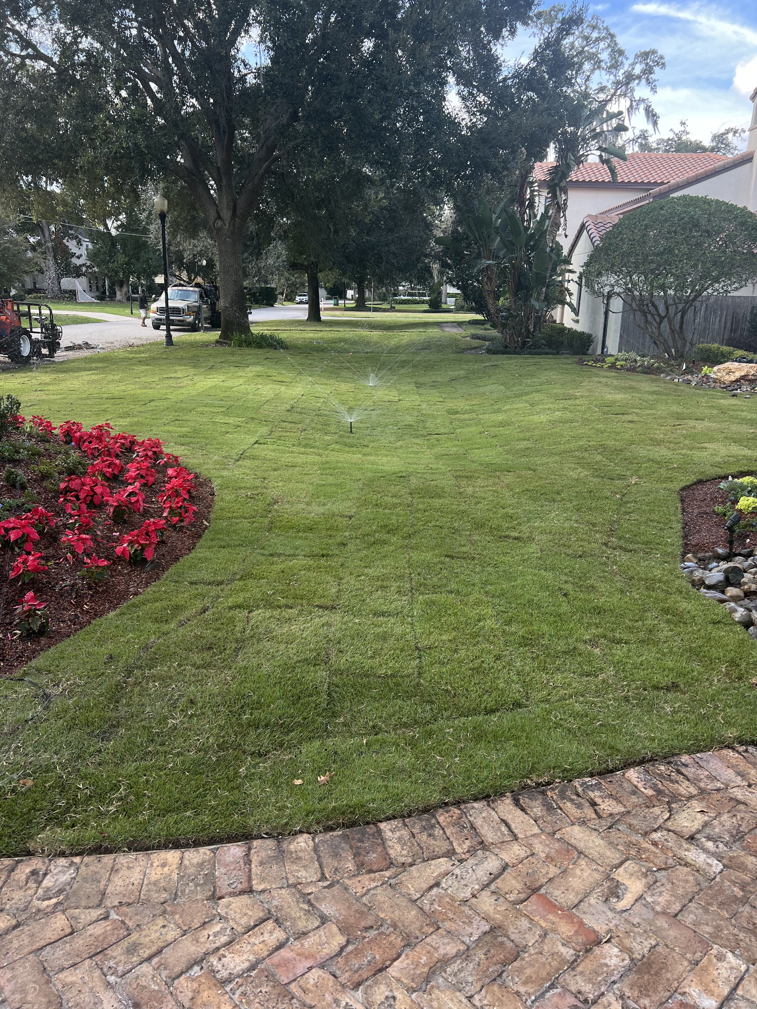 WInter Park Landscape Installation and renovation at 1411 Place Picardy including CitraZoy Zoysia Sod Installation which is watered by a irrigation make over that includes conversion over to Hunter MPR's .   RockBed Landscape Make over . All work com