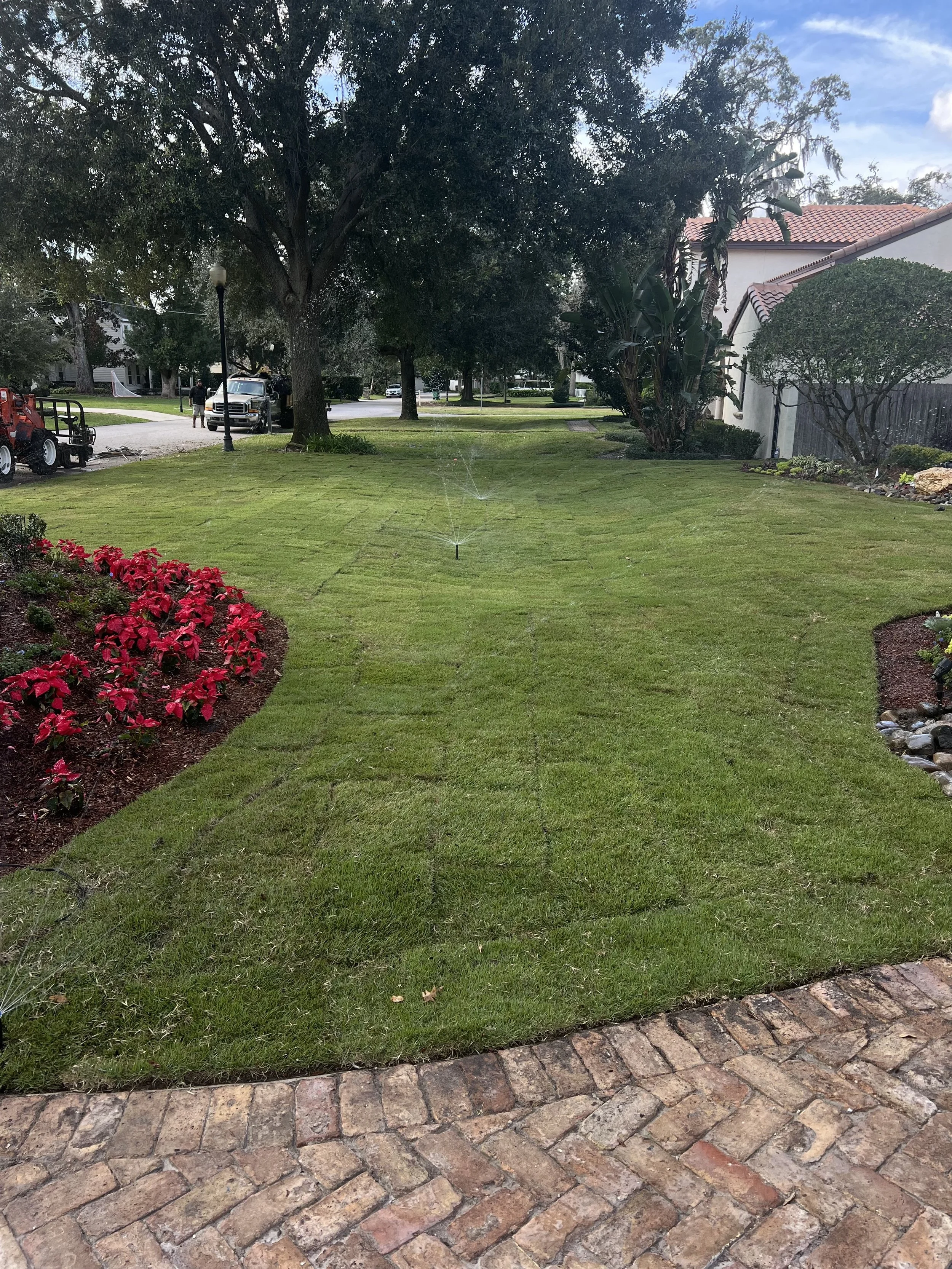 WInter Park Landscape Installation and renovation at 1411 Place Picardy including CitraZoy Zoysia Sod Installation which is watered by a irrigation make over that includes conversion over to Hunter MPR's .   RockBed Landscape Make over . All work com