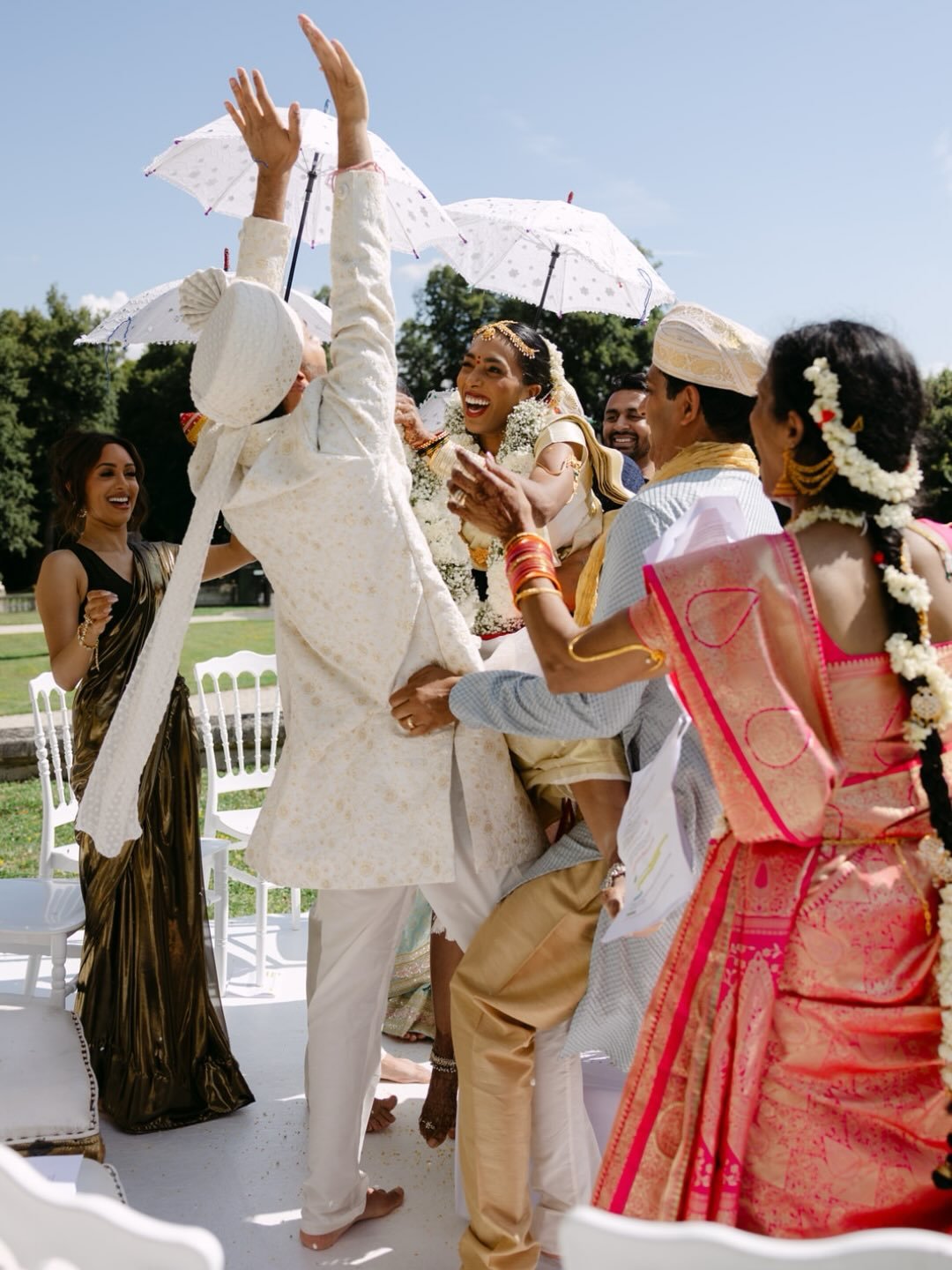 A vibrant Indian wedding celebration in France, overflowing with color, culture, and emotion.

Set against the timeless elegance of Ch&acirc;teau Saint Martin du Tertre, this American destination wedding blended vibrant traditions, deep emotion, and 