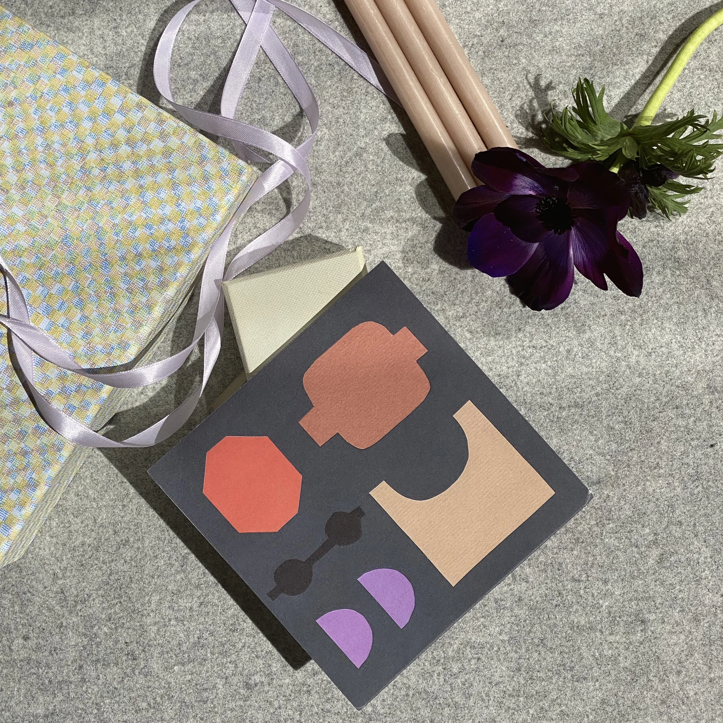 A beautiful gift box with lilac ribbon and card.