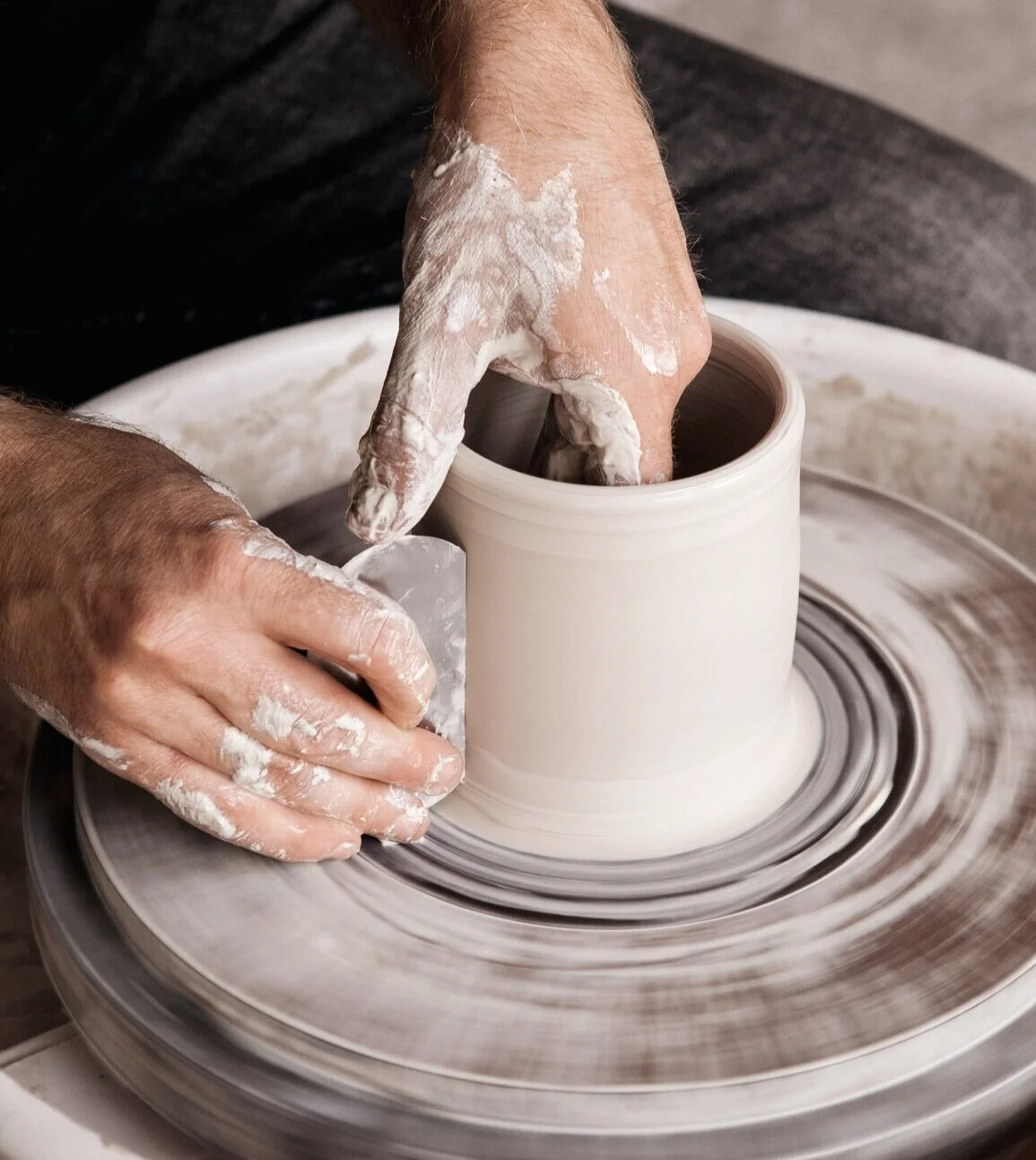 A potter works a vase we commissioned for a special birthday gift.