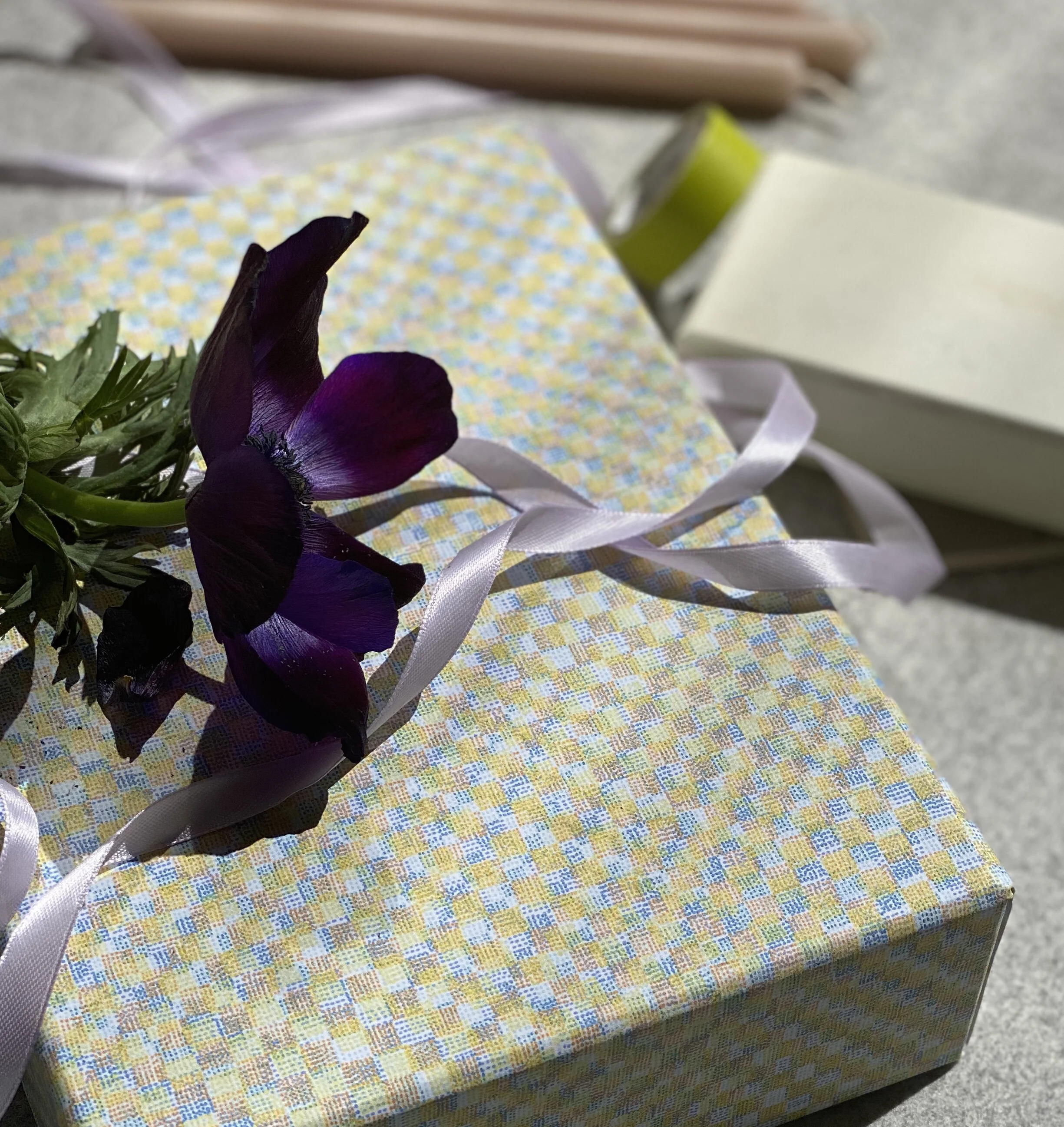 Bespoke gift box with lilac ribbon.