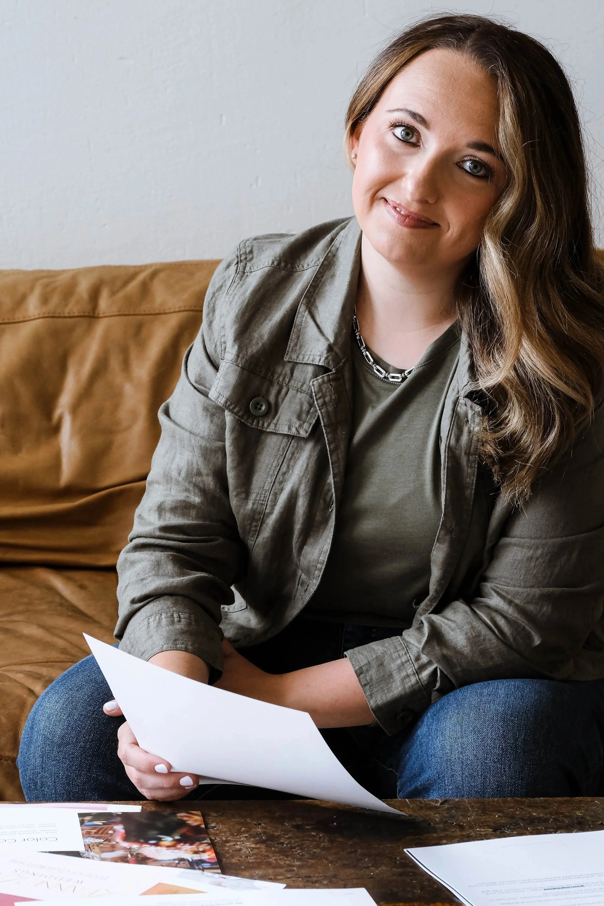 Brand strategist Morgan Specht sitting down and looking at branding documents