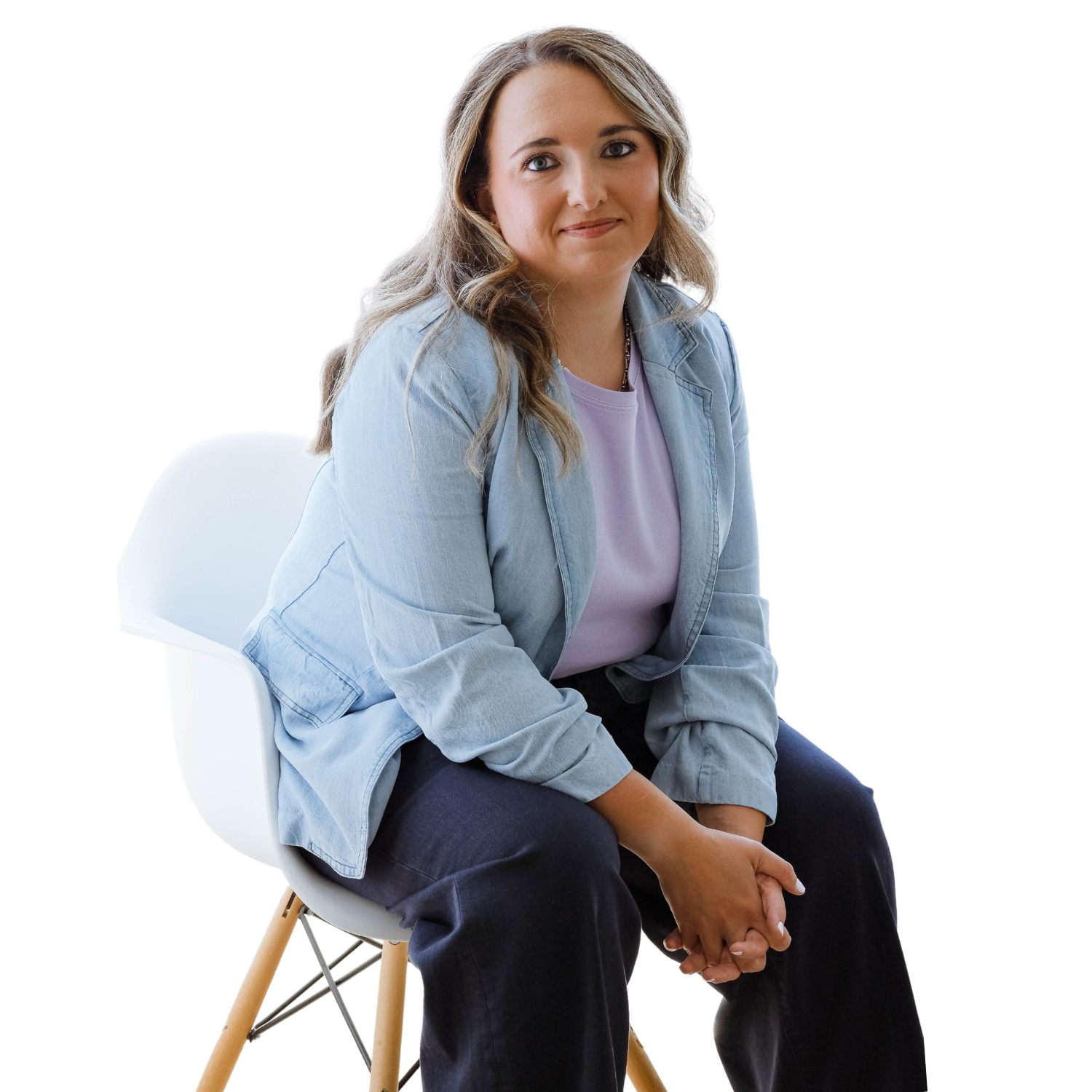 Morgan Specht brand designer sitting in chair smiling at camera