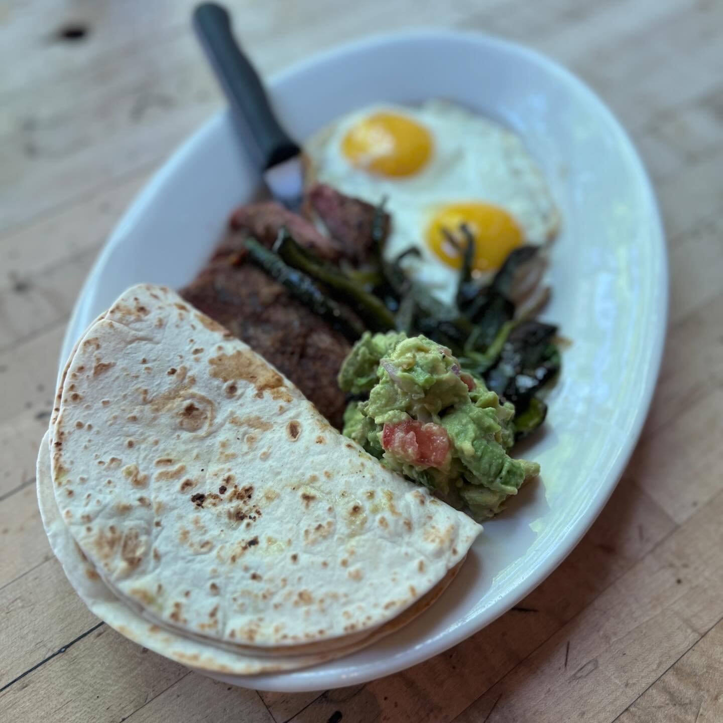 Specials! Carne Asada, chili marinated flank steak, sunny eggs, guacamole, grilled spring onions and poblanos, flour tortillas. Tres Leches Pancakes, three milk rum custard, strawberries, whipped cream. 
#westeggcafe but call us #westegg #brunch #bru