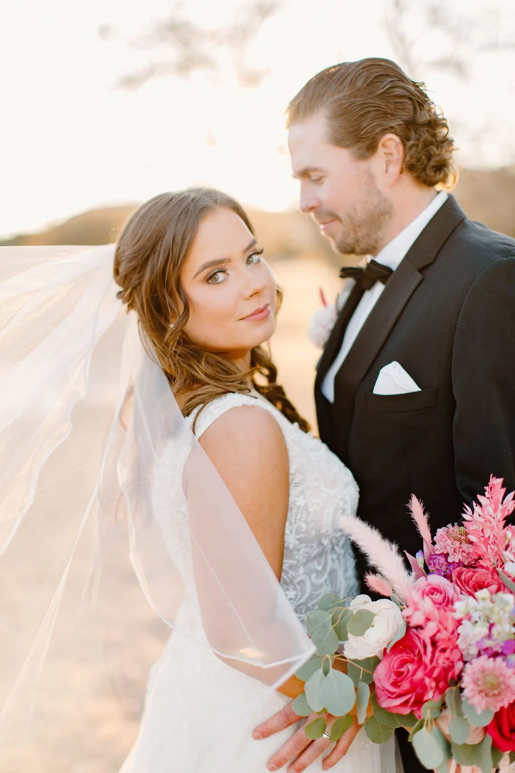 Bride and Groom posing together at rustic wedding in north texas