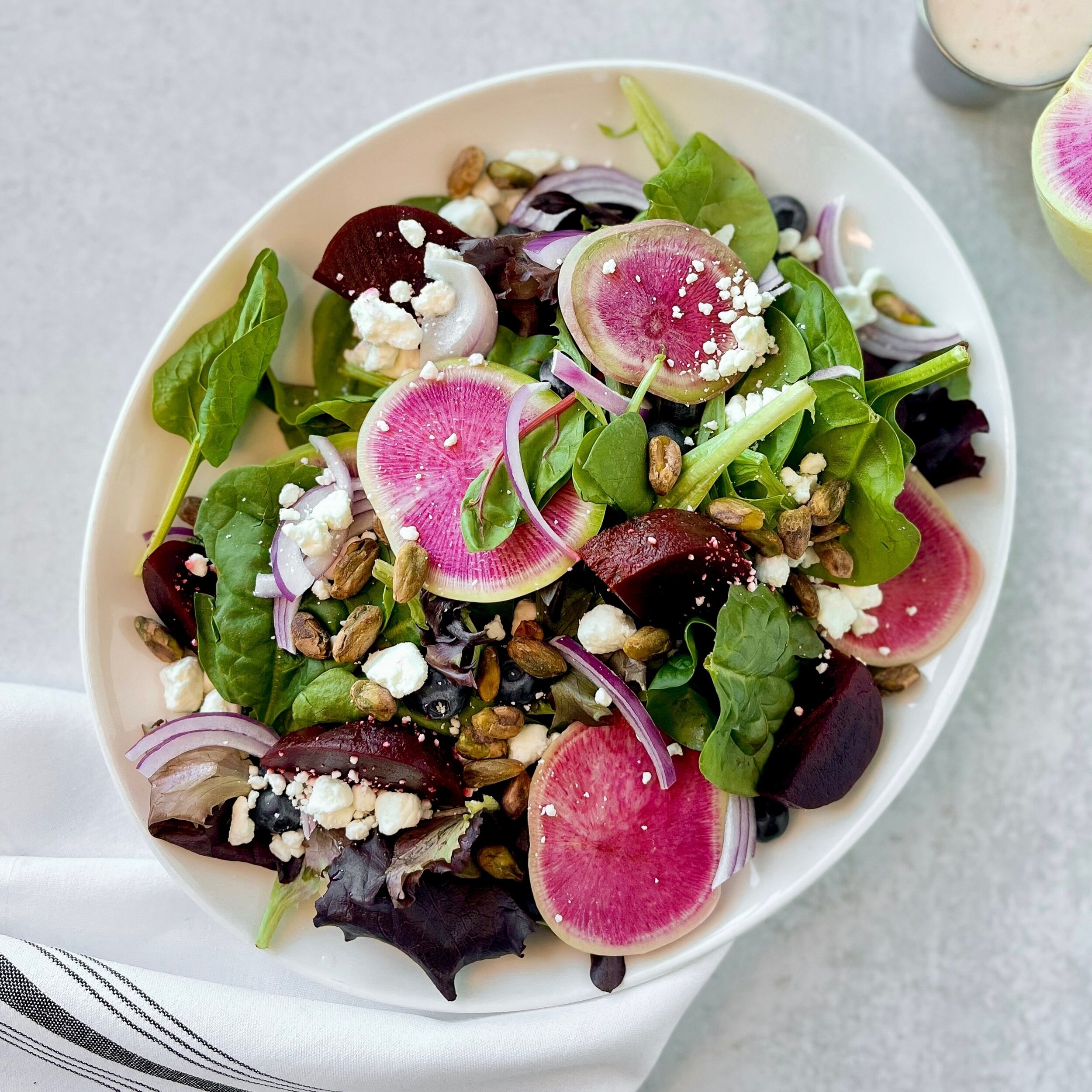 Get your taste buds buzzing with this vibrant Blueberry and Beet salad at Wedge Parkway! 🫐🥗 It&rsquo;s a berry-licious explosion of flavors with fresh baby greens with roasted beets, fresh blueberries, shaved red onion, watermelon radishes, crumble