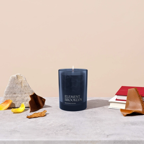 element candle readin with books.png