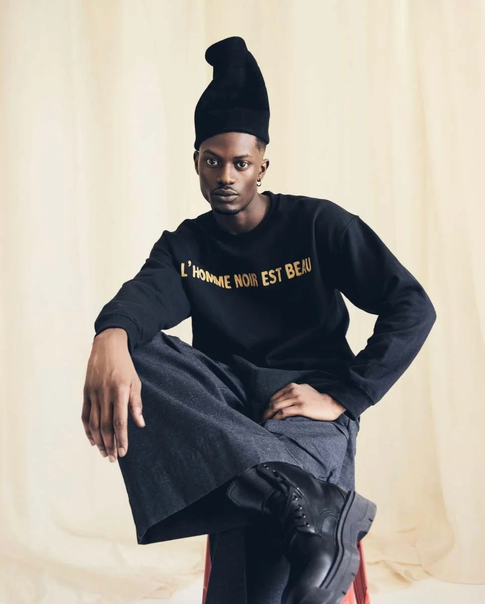 black man on stool 1f822f34-587d-49c9-ad22-5c20d08329e4.jpg