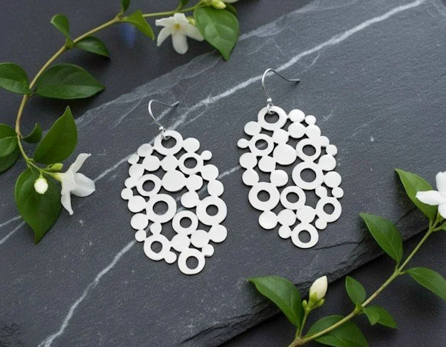 lisa hanging leaf earring on stone 5d103fe6-d735-4a9b-afc9-170734e0b08e.jpg
