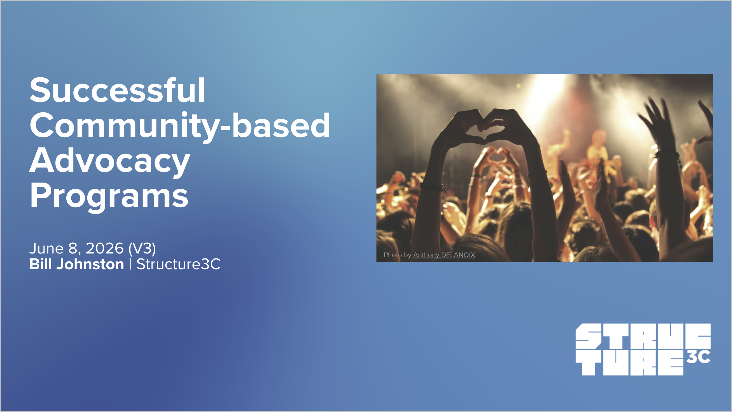 Slide presentation titled 'Successful Community-based Advocacy Programs' with a background photo of a crowd at a concert making heart shapes with their hands, with stage lights and a foggy atmosphere.