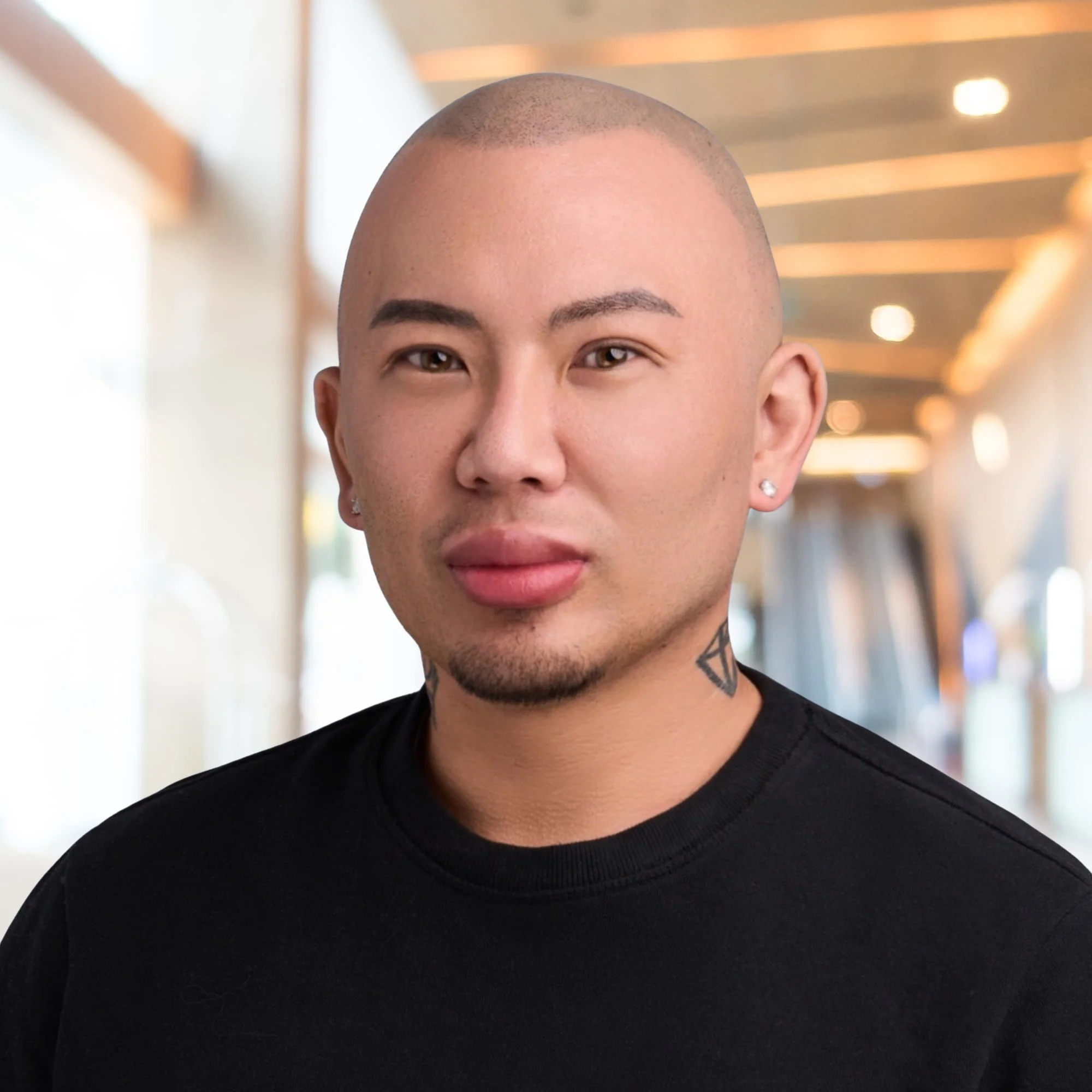 Chris Lee PMHNP-BC headshot wearing black sweater