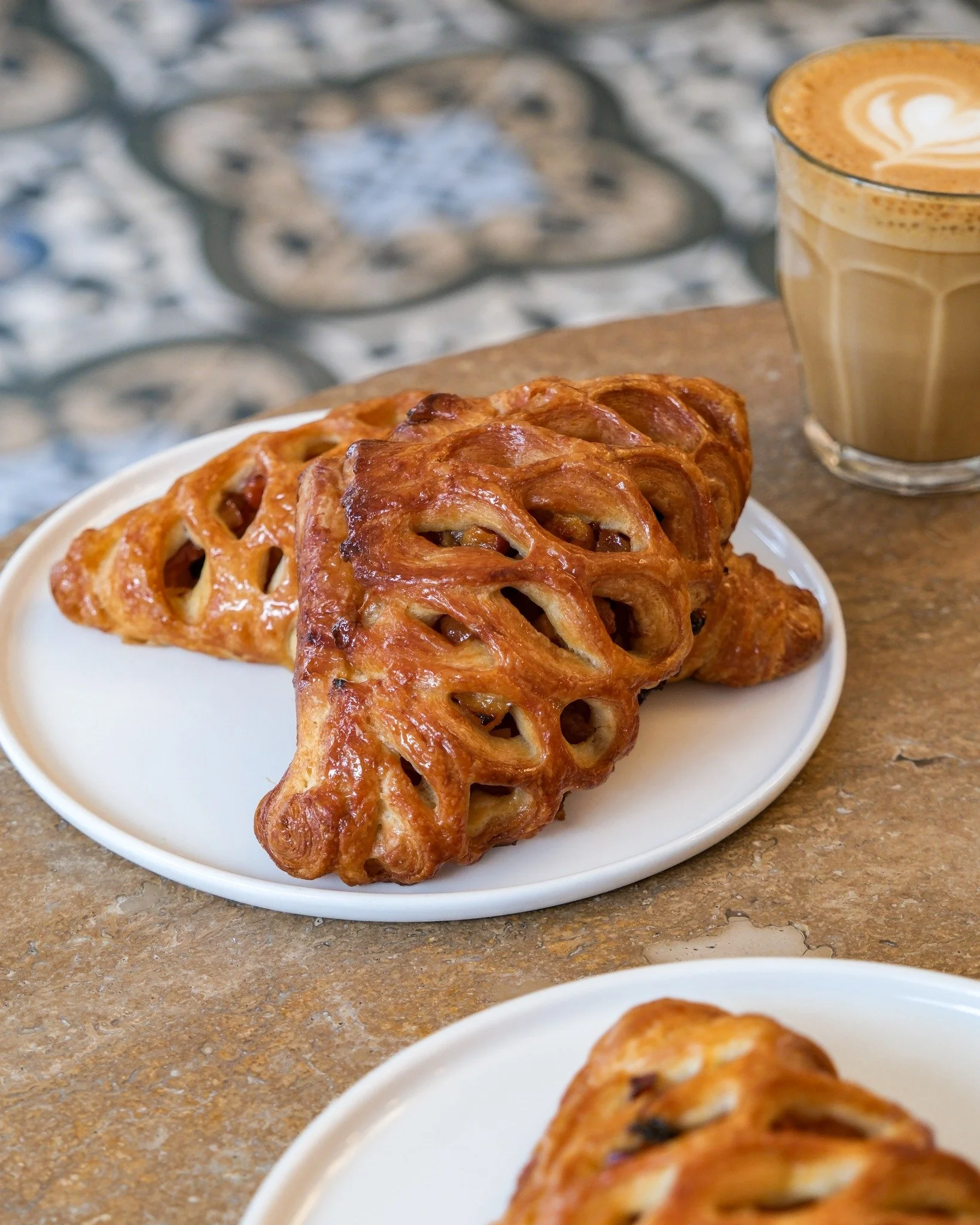 Meet July's viennoiserie special: the Nectarine Triangle.

Made with our signature croissant dough, honey roasted nectarines, and finished with a honey and marjoram glaze. It&rsquo;s our perfect summer pastry!

Only available this month. Have you tri