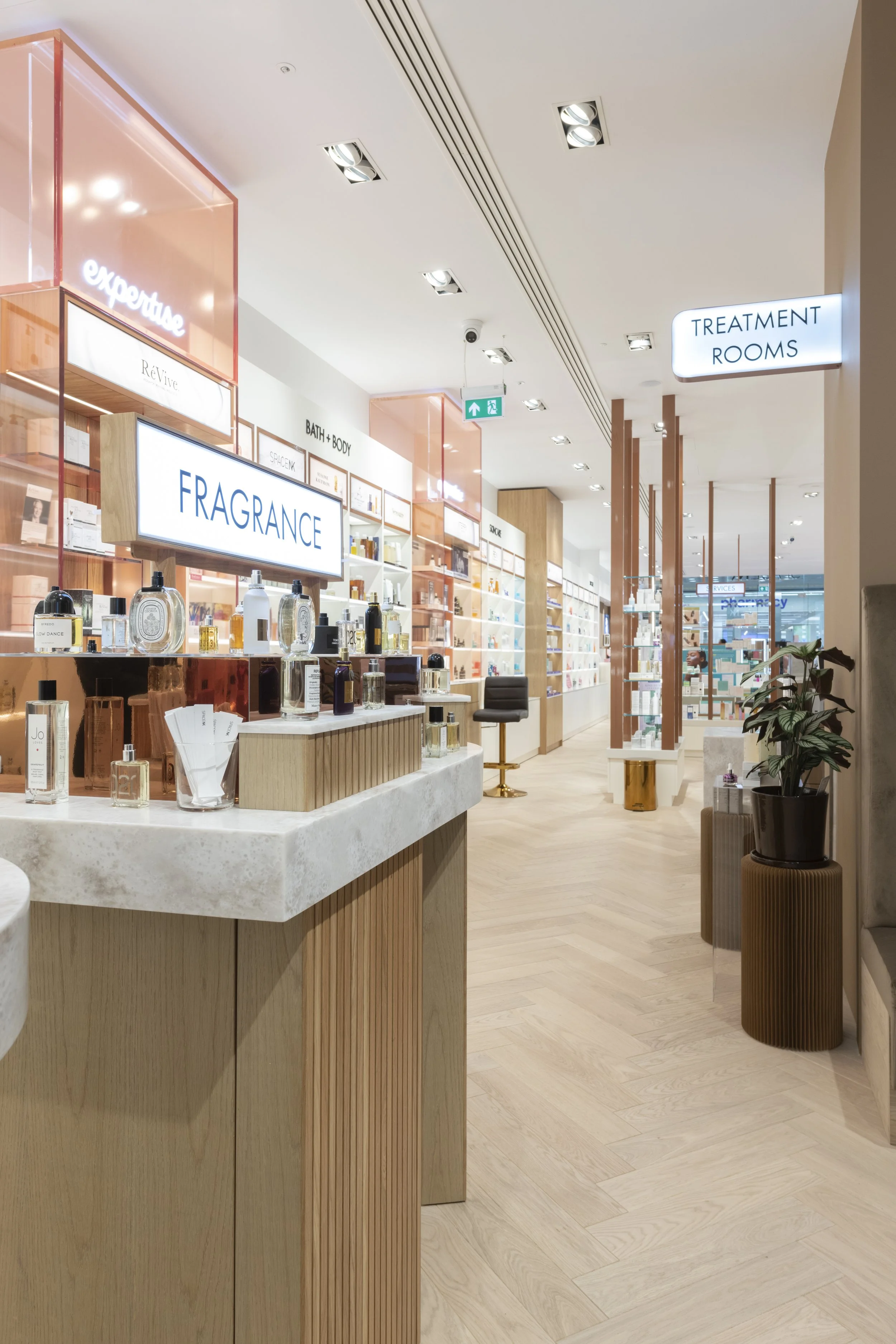 Space Nk display table with various perfume bottles including brands like Byredo and Tom Ford, 