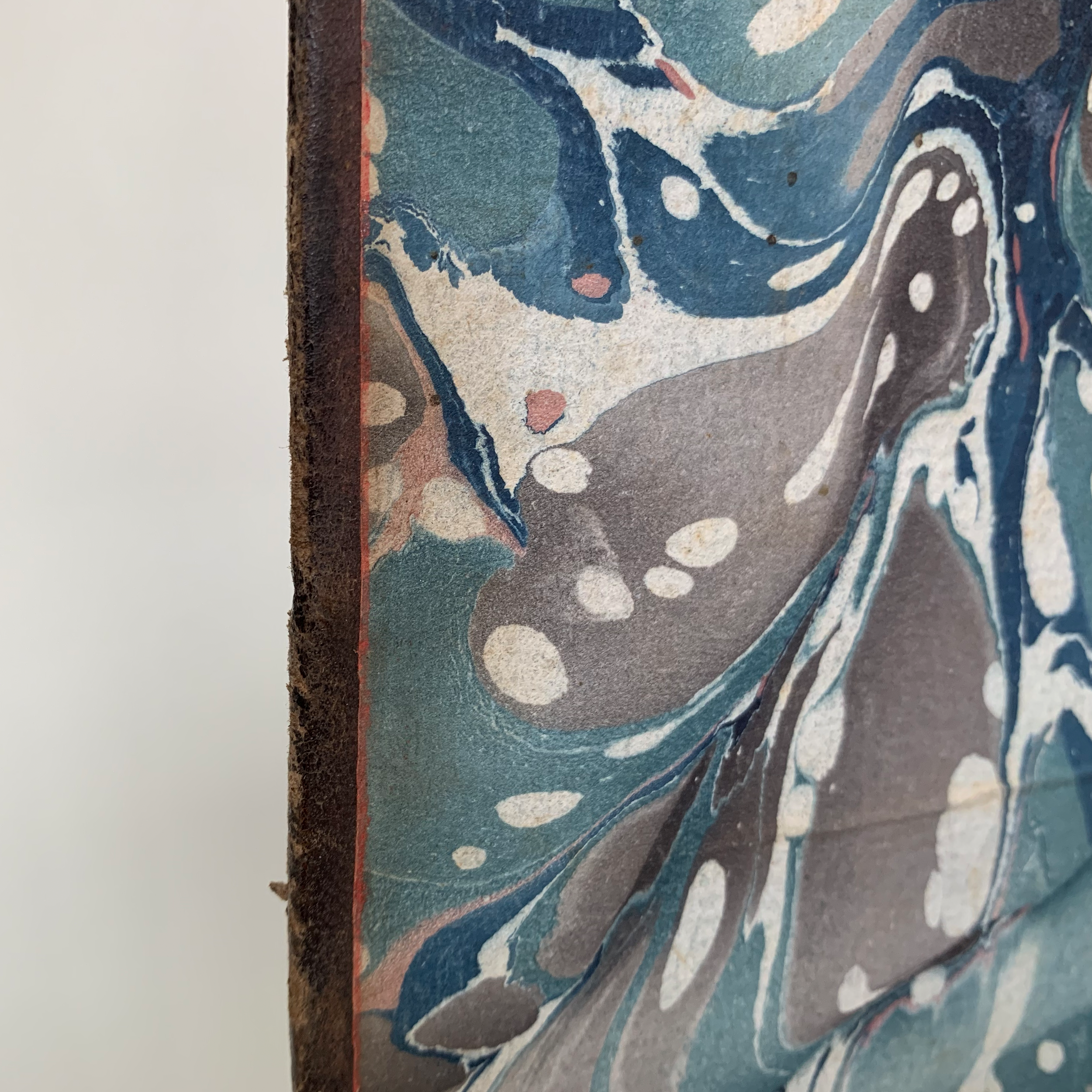 Red on the edge of the pastedown.