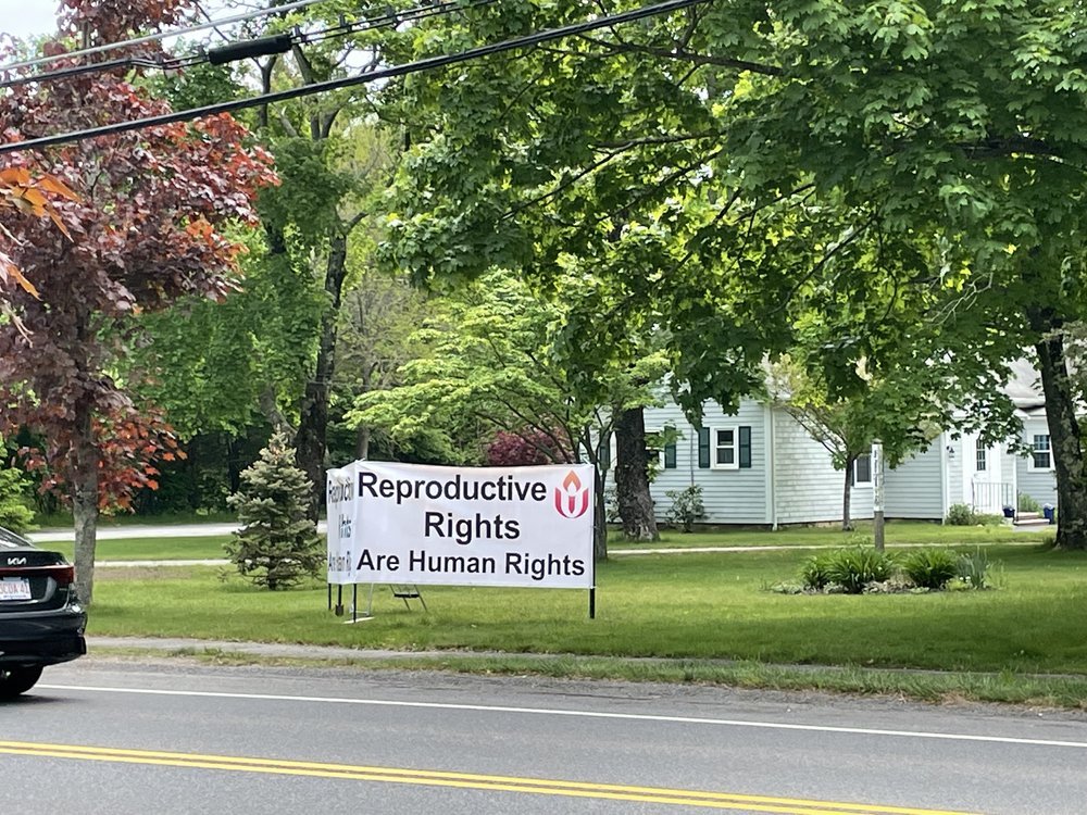 Public witness sign posted on Beal House lawn, spring 2022.