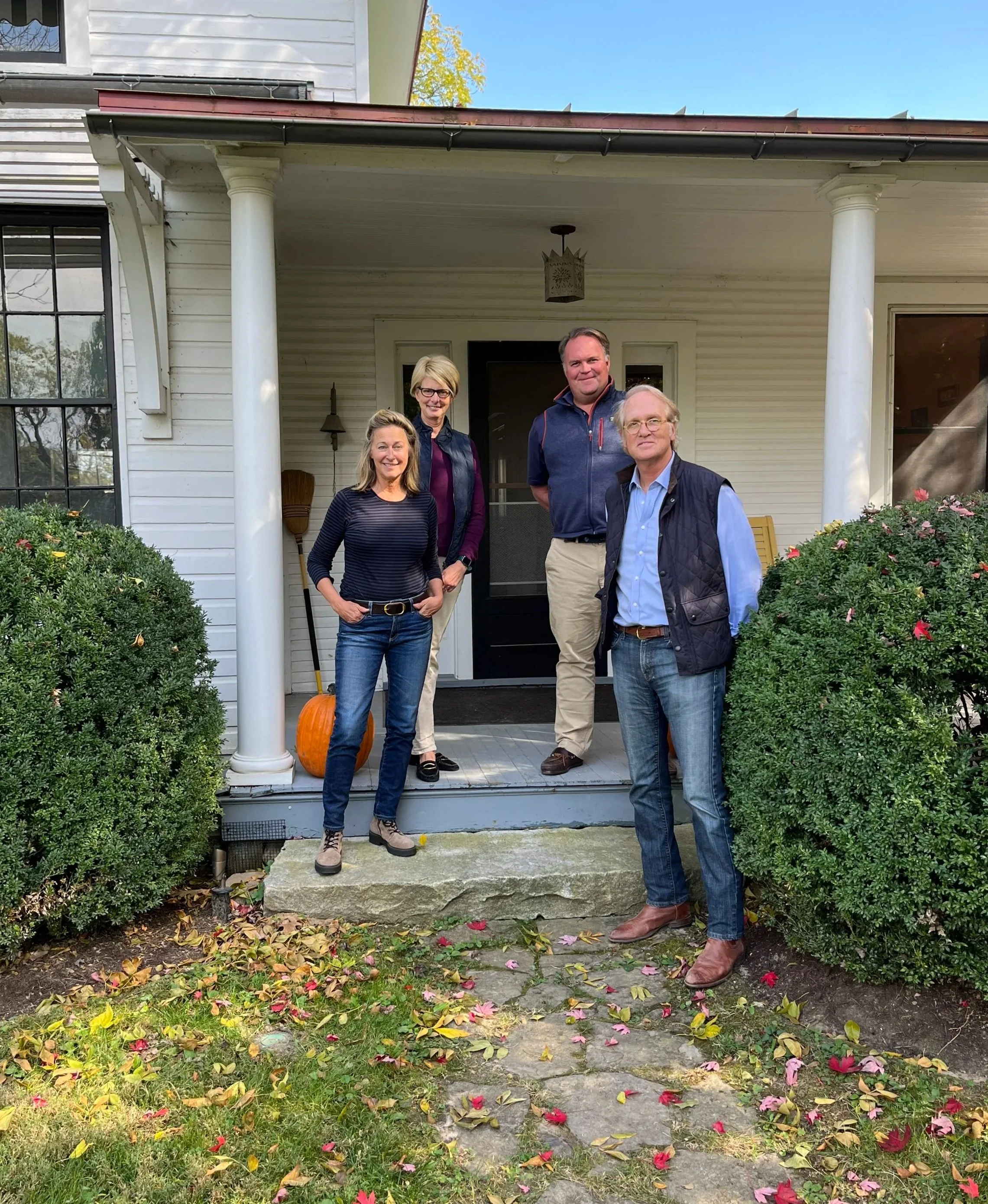 Board of Directors standing at the Farm House