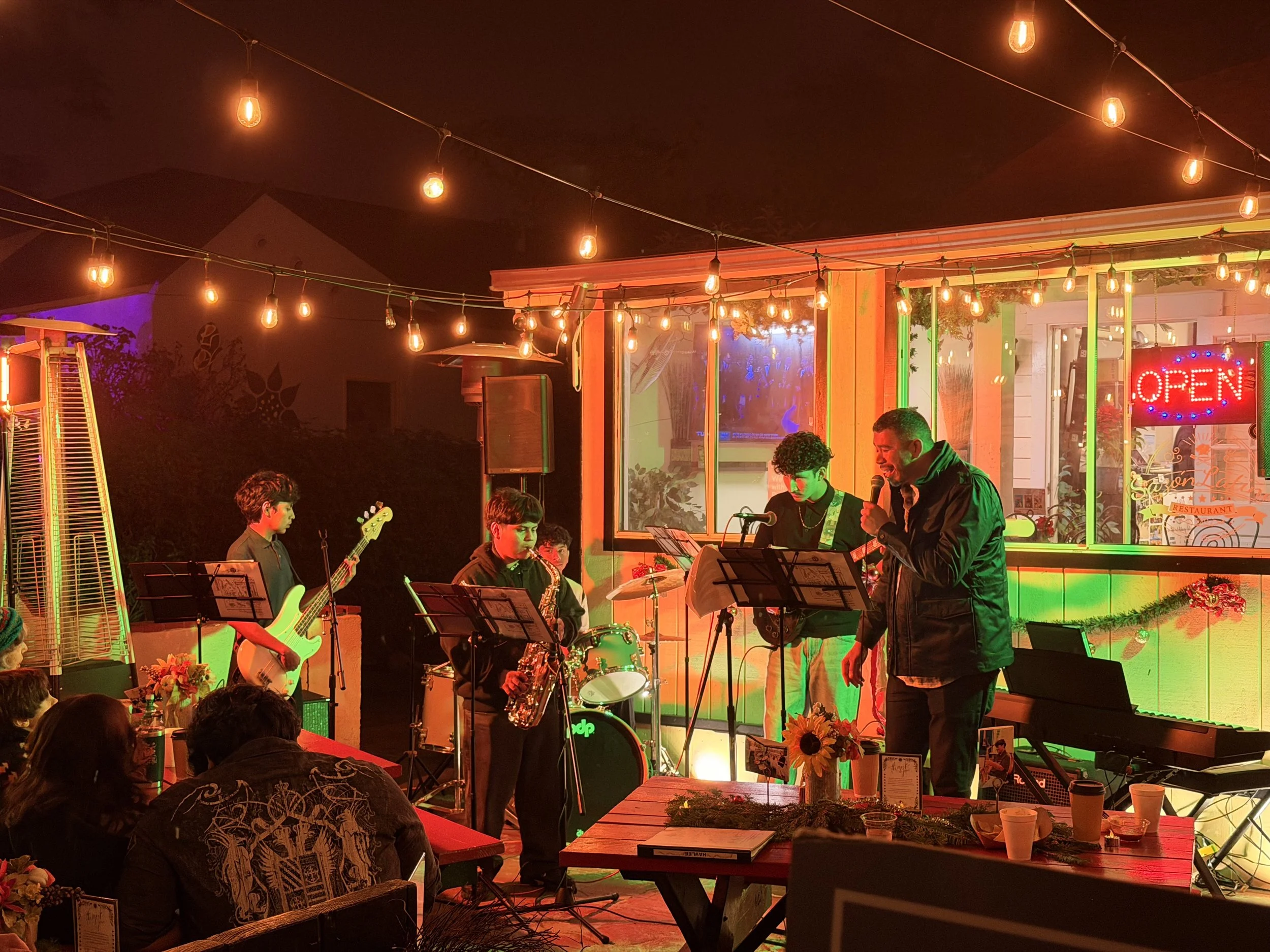 David, Director of Music Programs, and A combo performing music