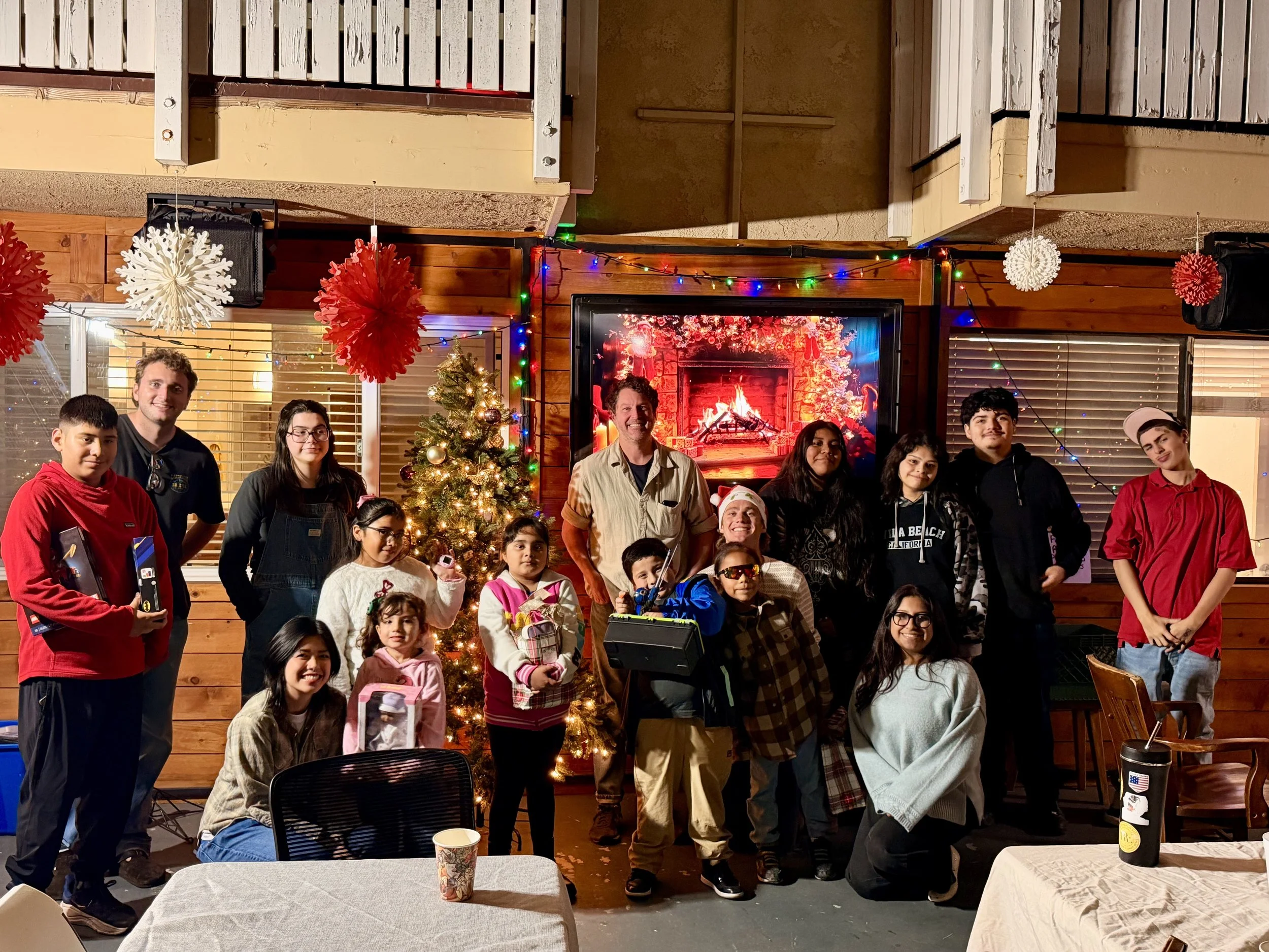Staff and kids celebrating our presents