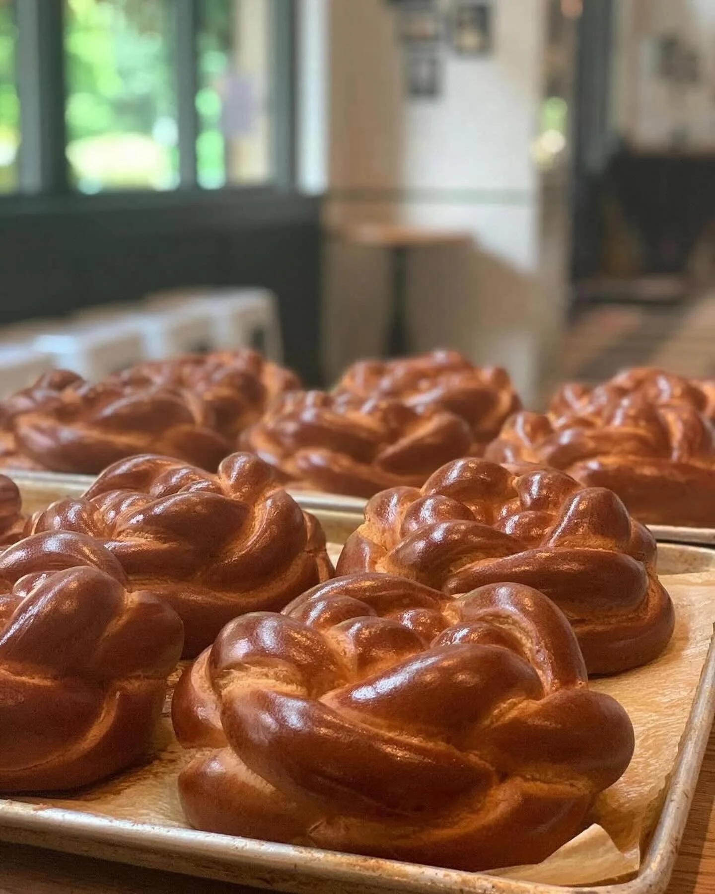 As usual, our team at @tgmbread will be braiding the most beautiful round challahs (plain and raisin) for the holidays; make sure to include a loaf in your catering order. Visit our website (link in bio) for Rosh Hashanah catering and dine in menu de