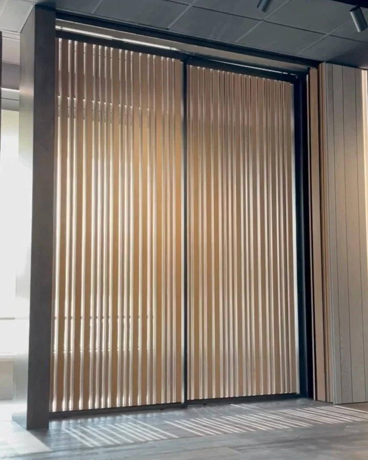 The MAGICO SUNSHADE System |  Using two materials - wood interior and aluminum exterior - with vertical orientable slats of different sizes, this system is crafted entirely in Italy with premium materials.

MAGICO window &amp; door panels are operate