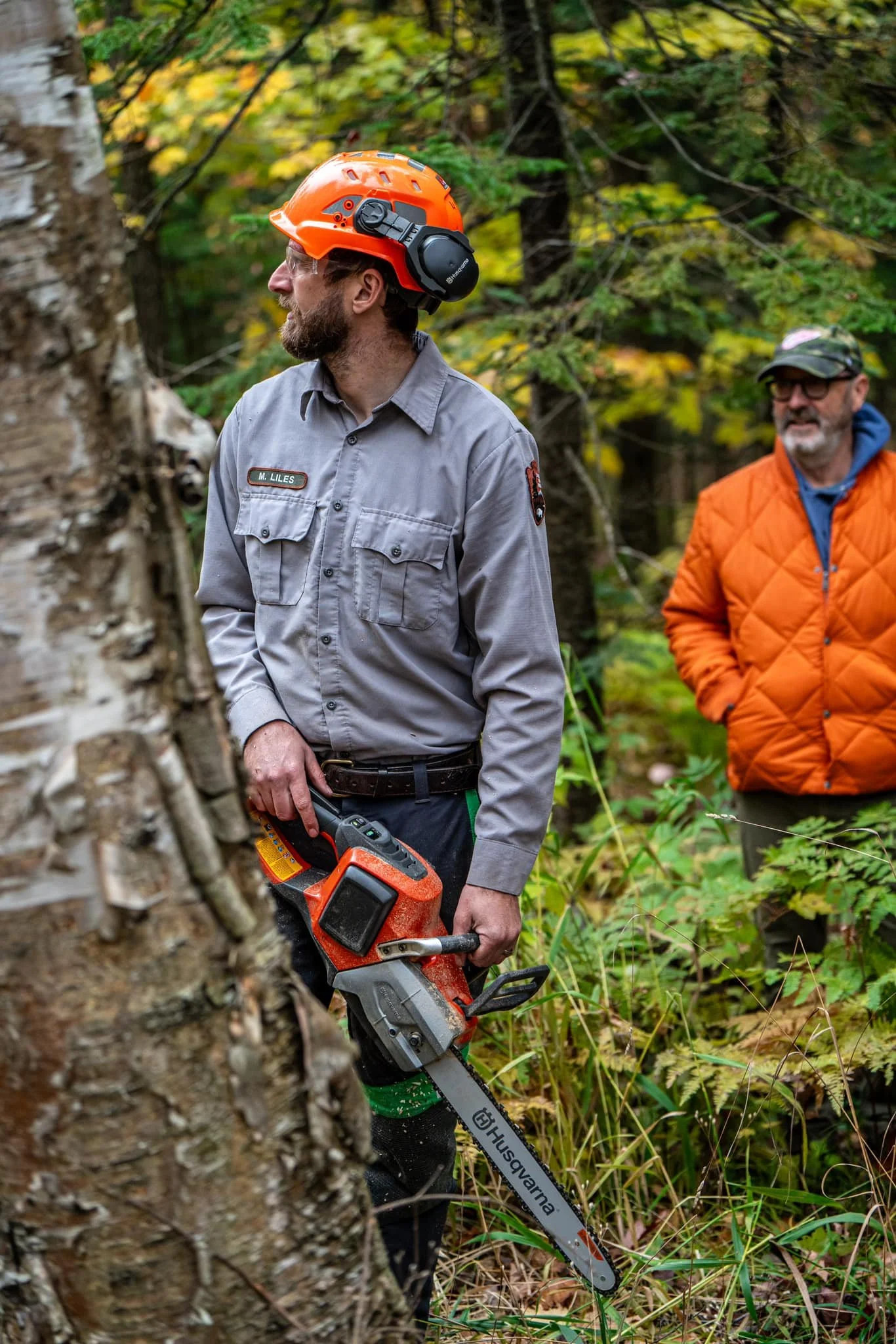 Pictured Rocks National Lakeshore Trail Supervisor Mark Liles tests an electric chain saw as NPLSF Executive Director Tom Irvine looks on. Photo: Sam Miller @robinhoodwasright