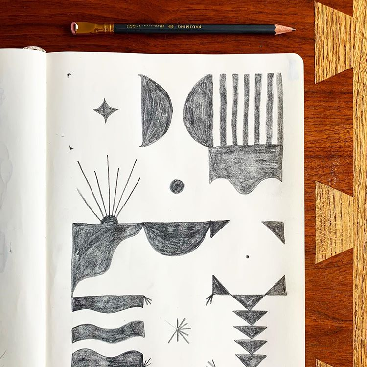 A page from Nikkita’s sketchbook, where she experiments with her signature geometric/organic designs.
