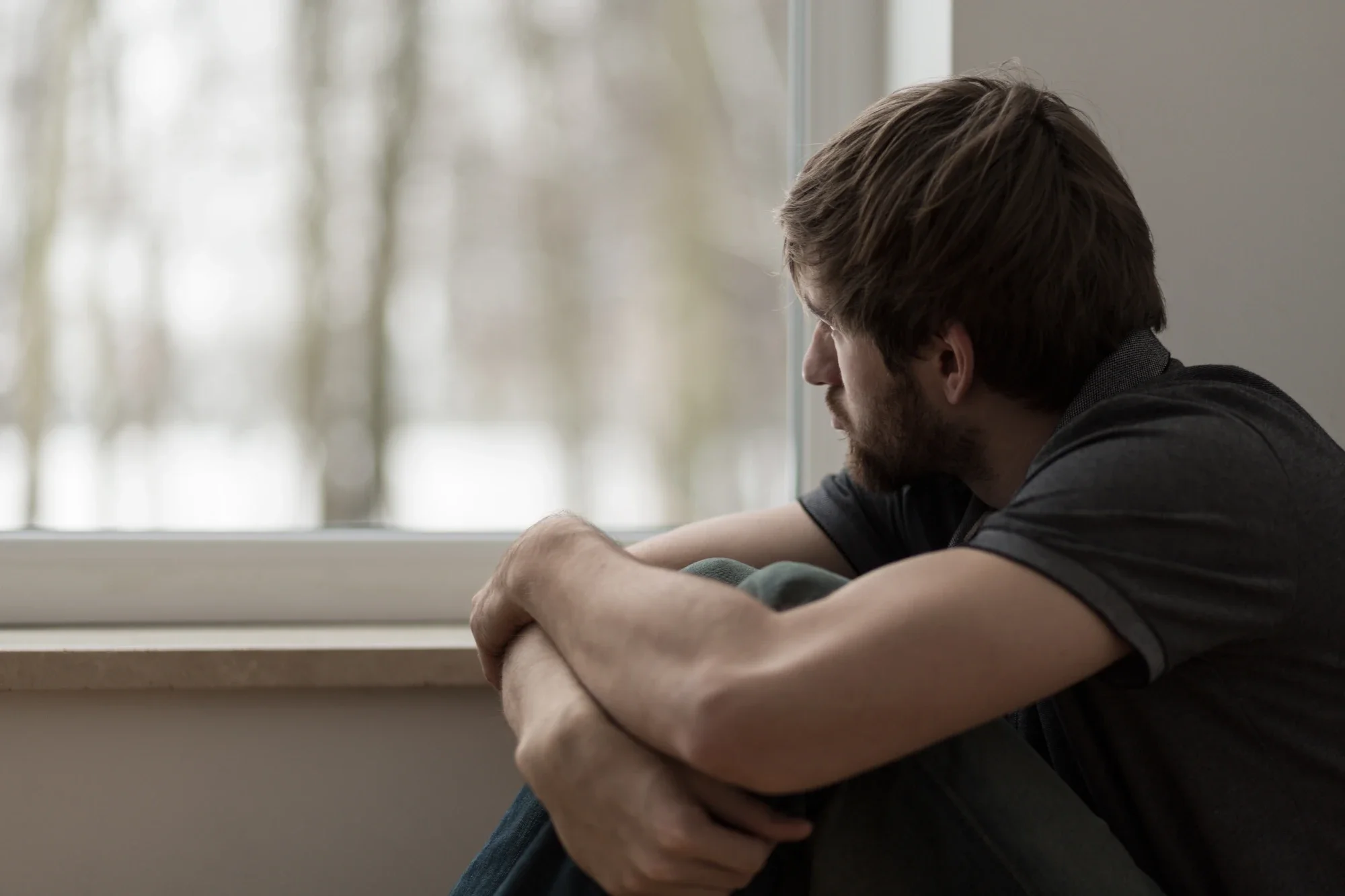 Person questioning whether their drinking habits may be a sign of alcoholism.