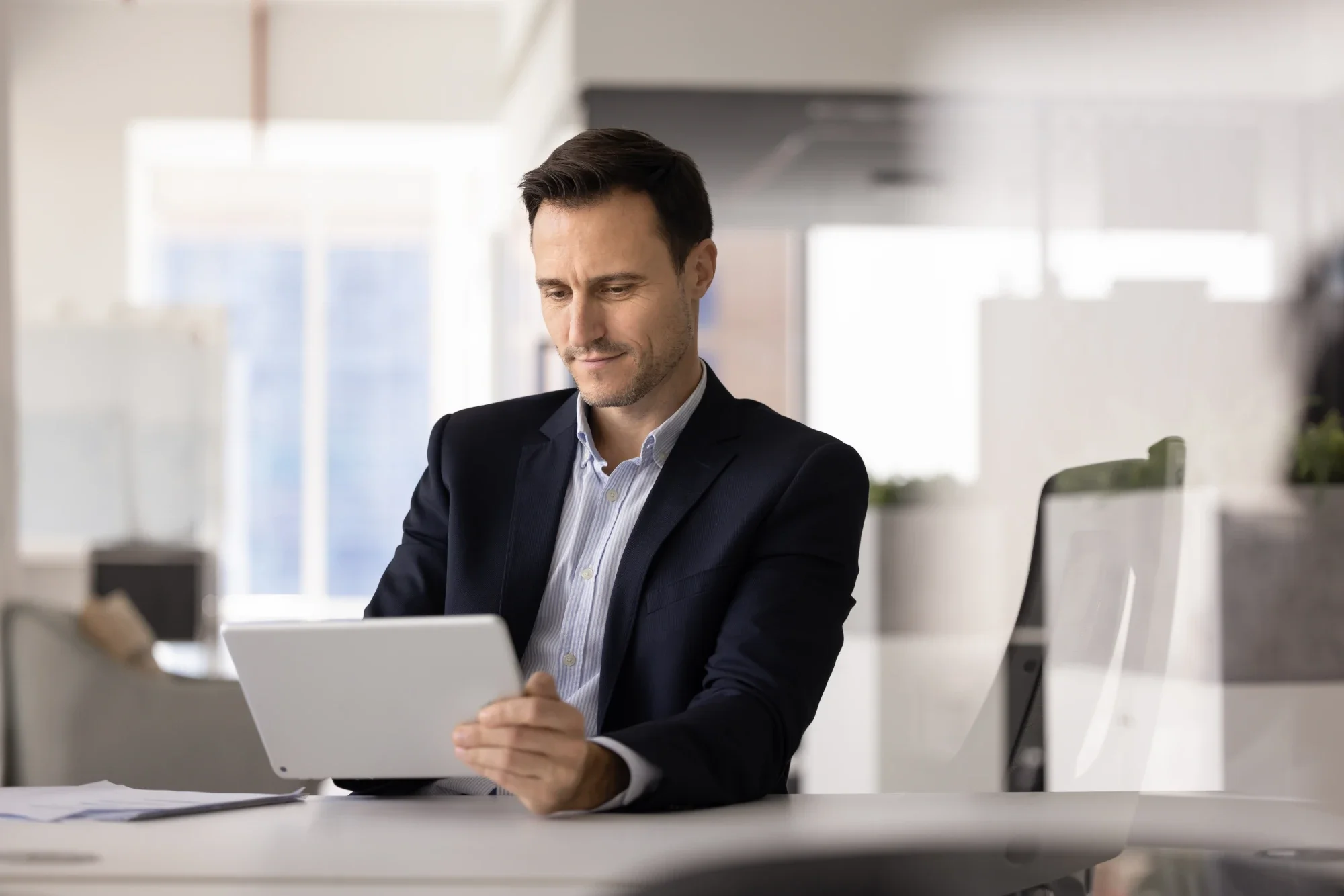 Professional reviewing workplace benefits and FMLA options before entering rehab.