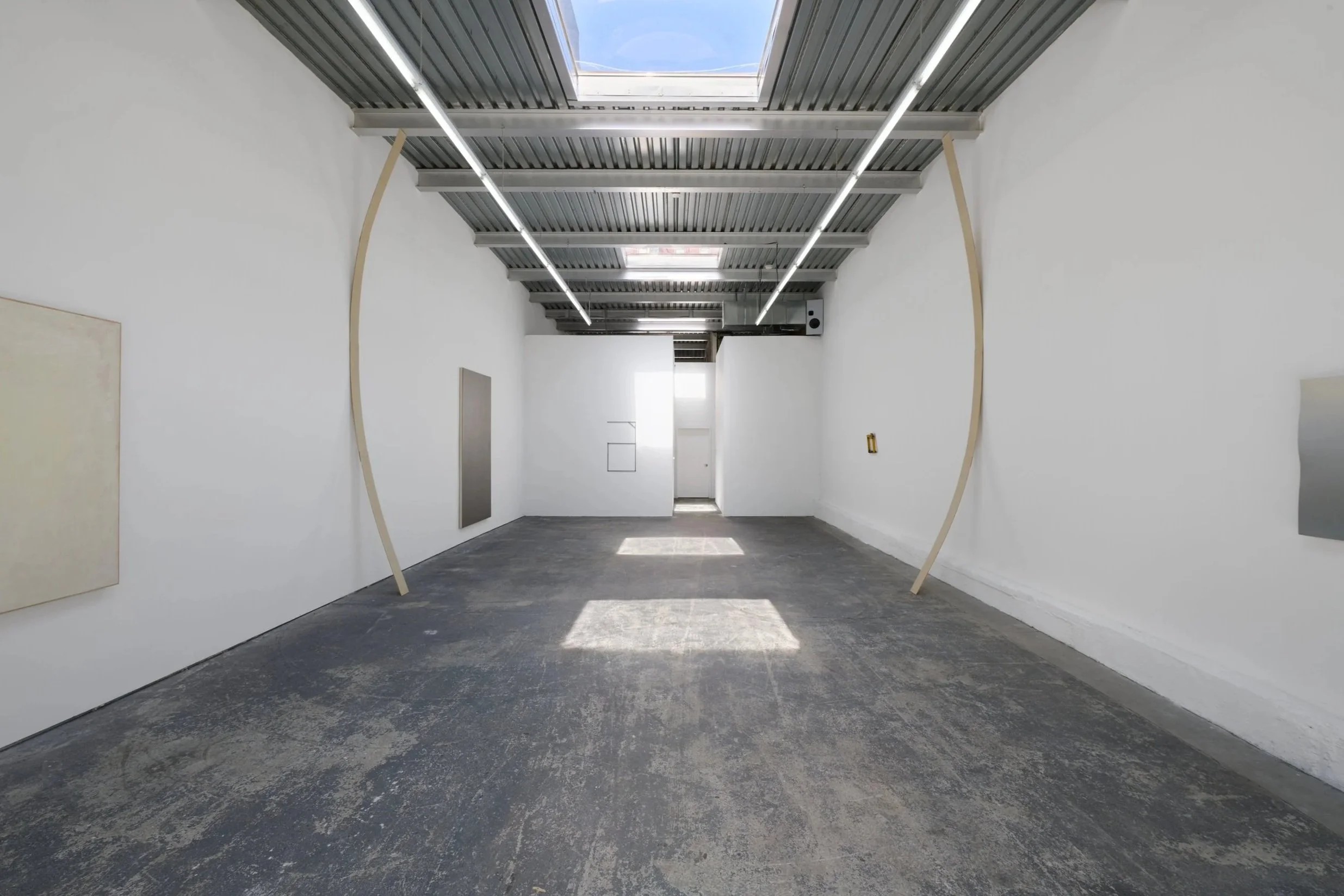 Pavilion , 2025, plywood and hardware in two parts, 198x5.5 in. each.