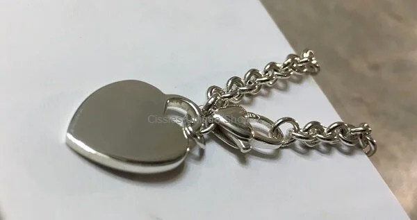 STERLING SILVER CHARM BRACELET