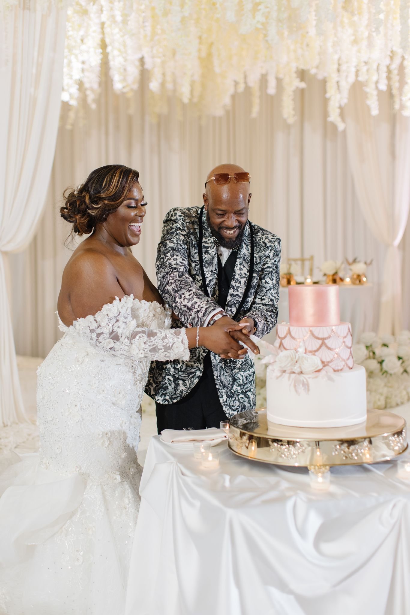 Happy Couple Slicing Their Wedding Cake