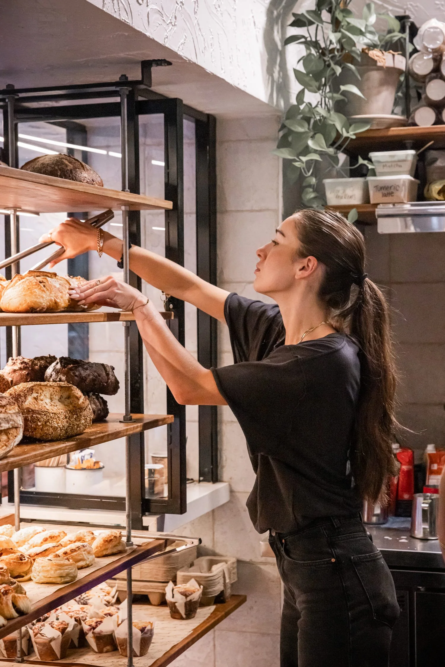 The Grumpy Baker_Business Manager Lily Cthurmer serving customers.jpg