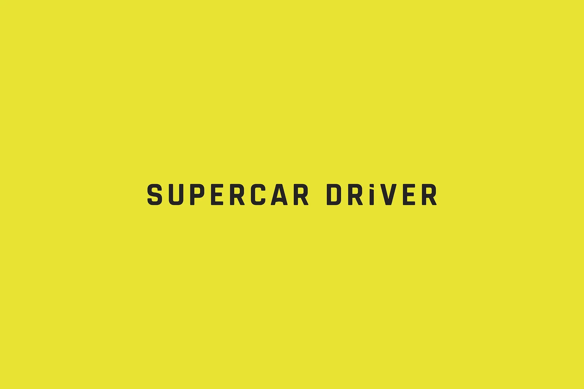 Yellow background with black text that reads "Supercar Driver".