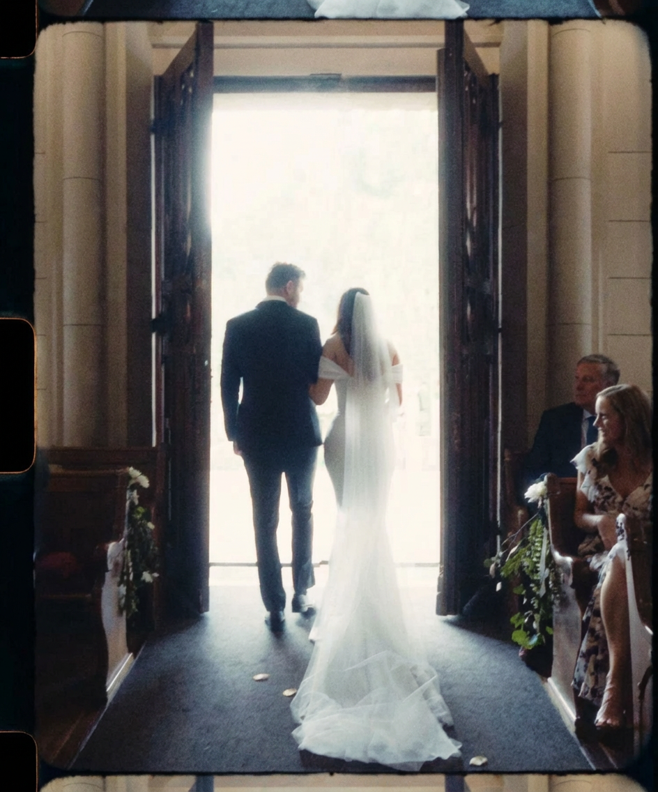 Bride and Groom walking out of Chapel
