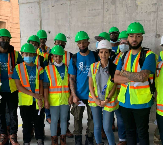 Careers in Construction Promo Image of Construction Interns in Green Hats