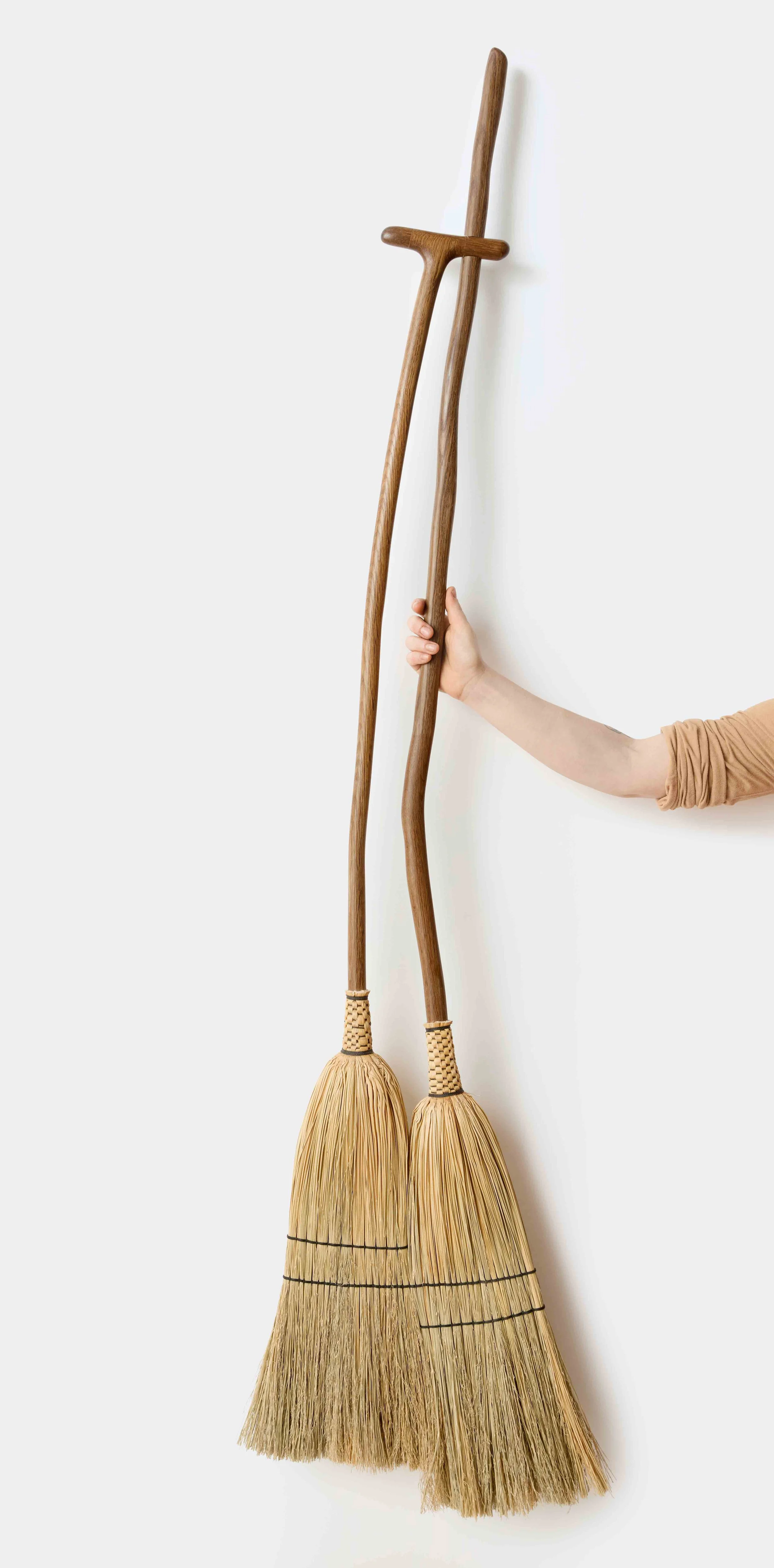 SmallFileForEmail_Couple_Broom_HandHold_PhotoCreditKateBenson.jpg